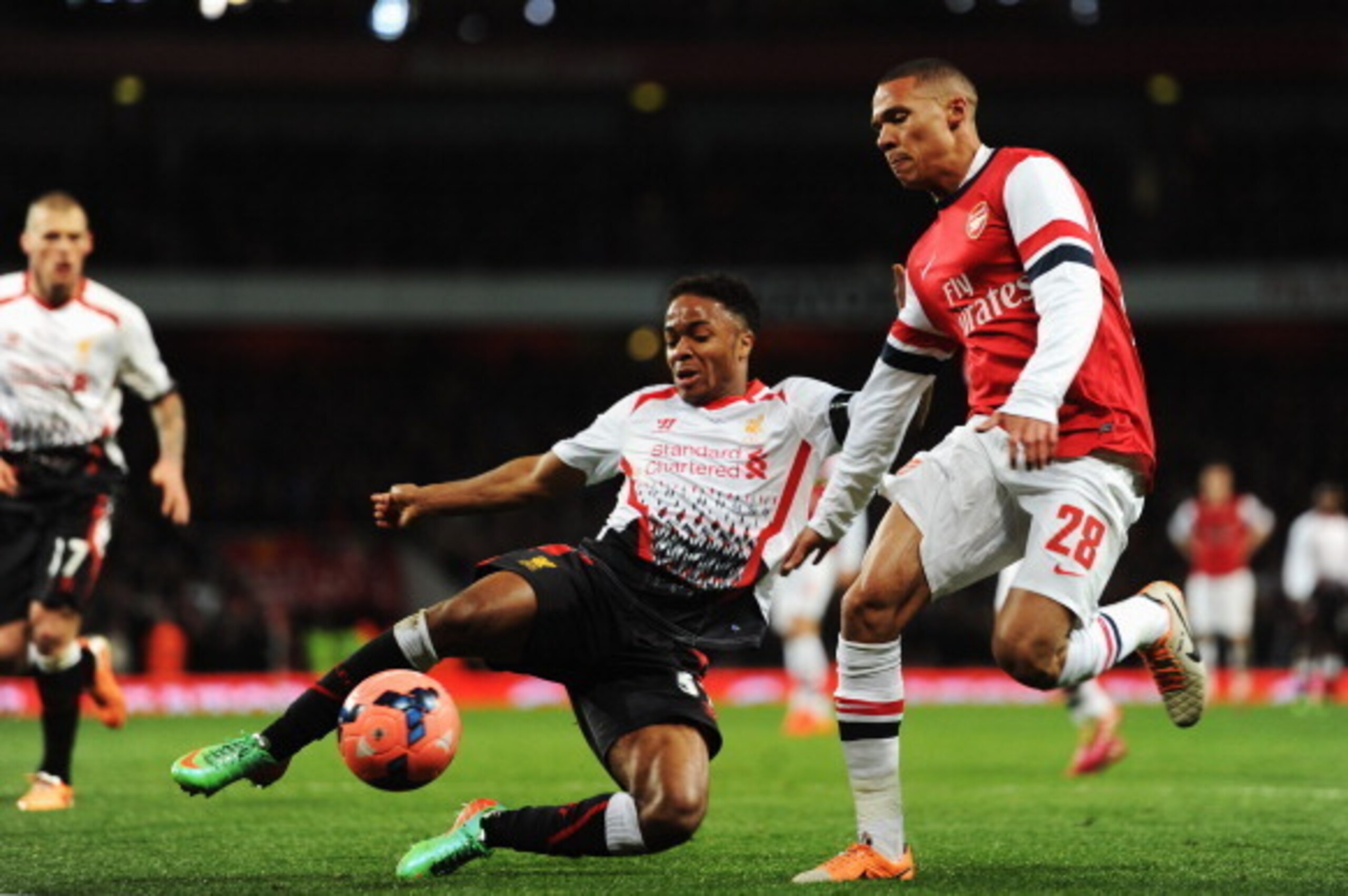 LONDON, ENGLAND - FEBRUARY 16:  (L-R) Raheem Sterling of Liverpool and Kieran Gibbs of Arsenal challenge for the ball during the FA Cup Fifth Round match between Arsenal and Liverpool at the Emirates Stadium on February 16, 2014 in London, England.  (Phot