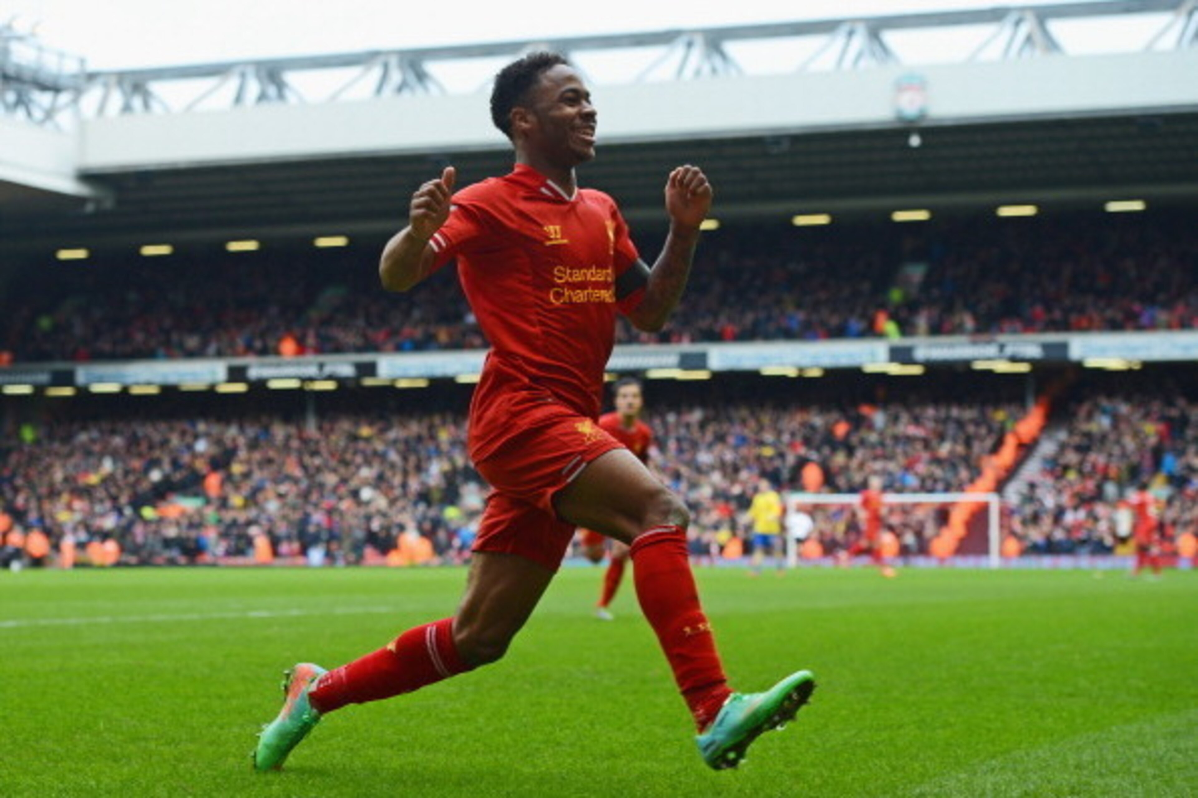 LIVERPOOL, ENGLAND - FEBRUARY 08:  Raheem Sterling of Liverpool celebrates scoring the fifth goal during the Barclays Premier League match between Liverpool and Arsenal at Anfield on February 8, 2014 in Liverpool, England.  (Photo by Michael Regan/Getty I