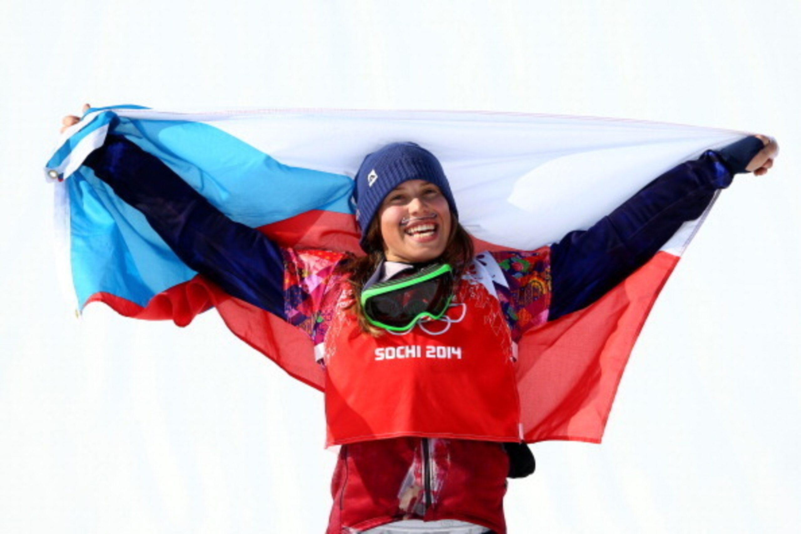 SOCHI, RUSSIA - FEBRUARY 16:  Gold medalist Eva Samkova of the Czech Republic celebrates during the flower ceremony for the Ladies' Snowboard Cross Finals on day nine of the Sochi 2014 Winter Olympics at Rosa Khutor Extreme Park on February 16, 2014 in So