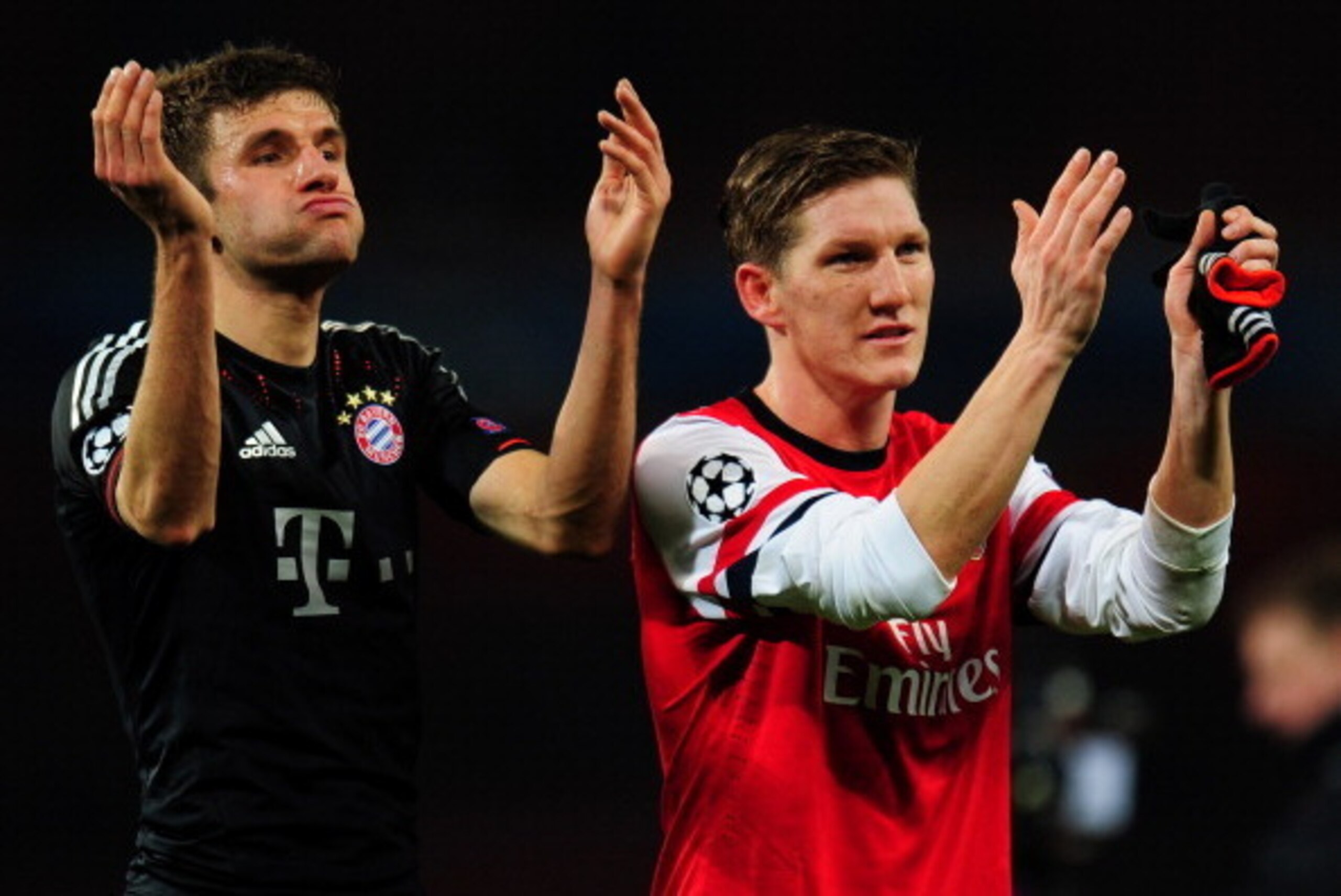 LONDON, ENGLAND - FEBRUARY 19:  Thomas Mueller  and Bastian Schweinsteiger of Bayern Muenchen applaud the fans after the UEFA Champions League round of 16 first leg match between Arsenal and Bayern Muenchen at Emirates Stadium on February 19, 2013 in Lond