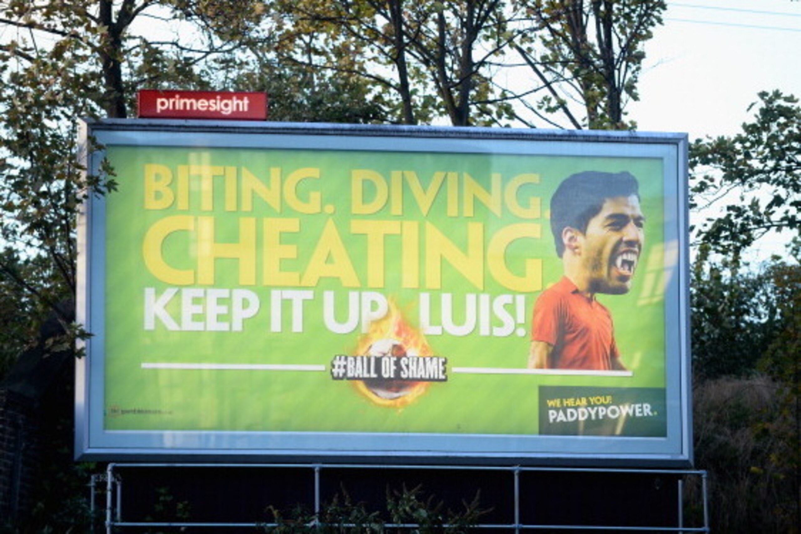 LONDON, ENGLAND - NOVEMBER 02:  An advertising board with Luis Suarez of Liverpool on it is seen near the stadium during the Barclays Premier League match between Arsenal and Liverpool at Emirates Stadium on November 2, 2013 in London, England.  (Photo by