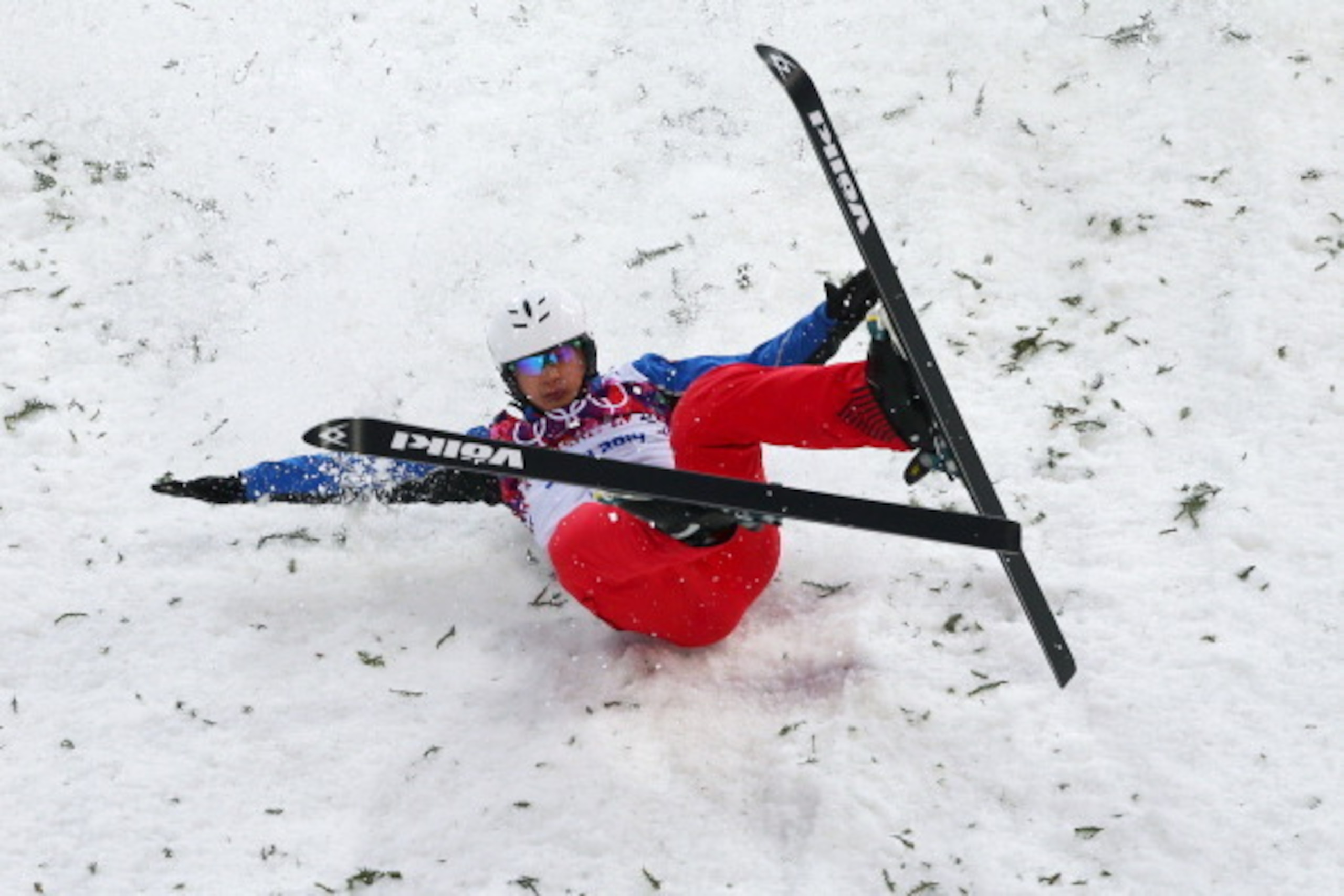 SOCHI, RUSSIA - FEBRUARY 17:  Zhongqing Liu of China crashes in the Freestyle Skiing Men's Aerials Qualification on day ten of the 2014 Winter Olympics at Rosa Khutor Extreme Park on February 17, 2014 in Sochi, Russia.  (Photo by Mike Ehrmann/Getty Images