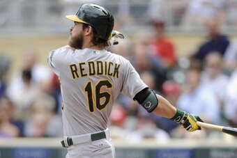 MINNEAPOLIS, MN - SEPTEMBER 12: Josh Reddick #16 of the Oakland Athletics hits a two-run home run against the Minnesota Twins during the eighth inning of the game on September 12, 2013 at Target Field in Minneapolis, Minnesota. The Athletics defeated the 