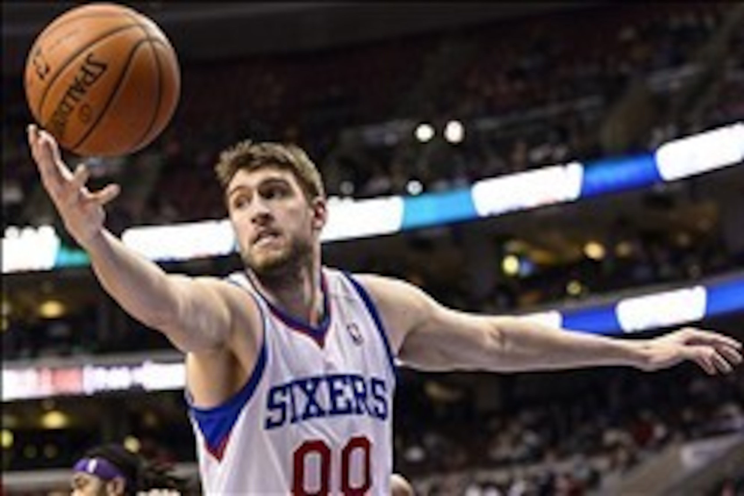 Feb 7, 2014; Philadelphia, PA, USA; Philadelphia 76ers center Spencer Hawes (00) grabs a rebound during the second quarter against the Los Angeles Lakers at the Wells Fargo Center. The Lakers defeated the Sixers 112-98. Mandatory Credit: Howard Smith-USA 