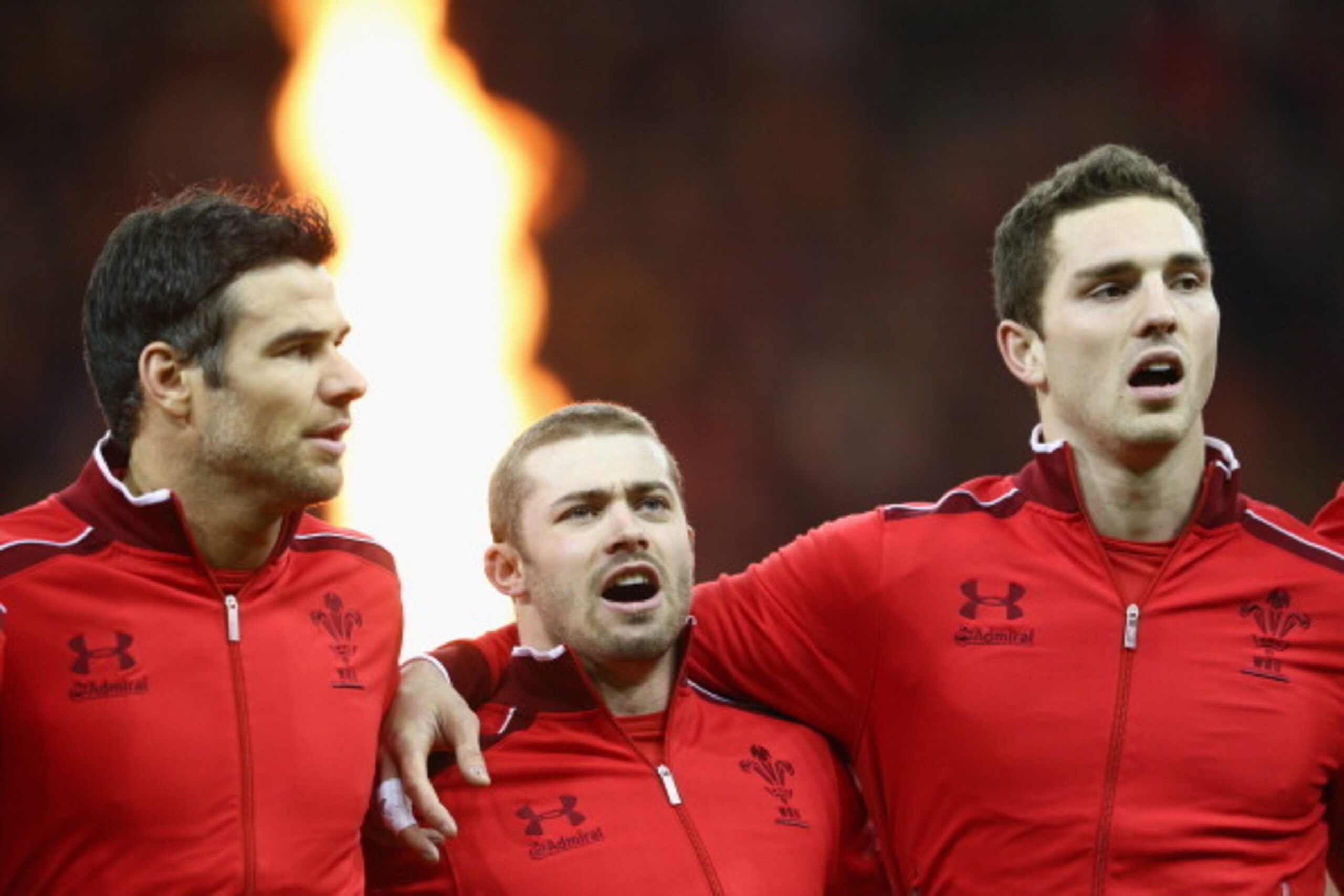 CARDIFF, WALES - FEBRUARY 01:  Mike Phillips (L) Leigh Halfpenny (C) and George North (R) of Wales during the playing of the national anthem during the RBS Six Nations match between Wales and Italy at the Millenium Stadium on February 1, 2014 in Cardiff, 