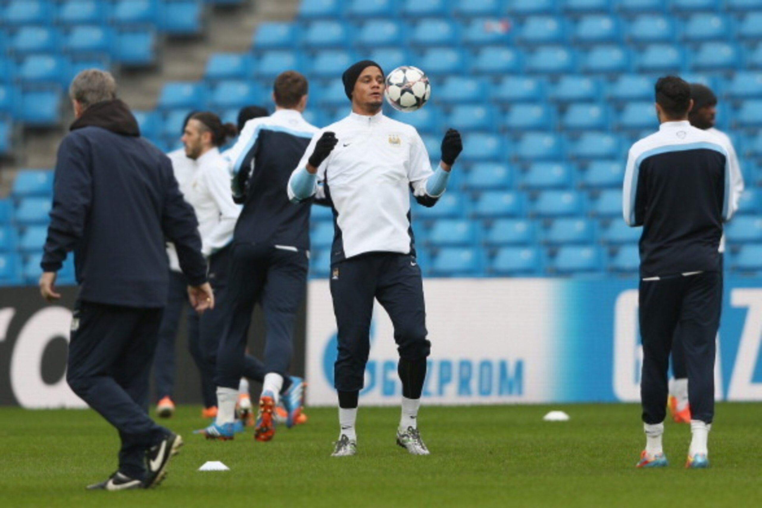 MANCHESTER, ENGLAND - FEBRUARY 17:  Vincent Kompany of Manchester City in action during a training session ahead of their UEFA Champions League Round of 16 match 1st leg against Barcelona  at Etihad Stadium on February 17, 2014 in Manchester, England.  (P