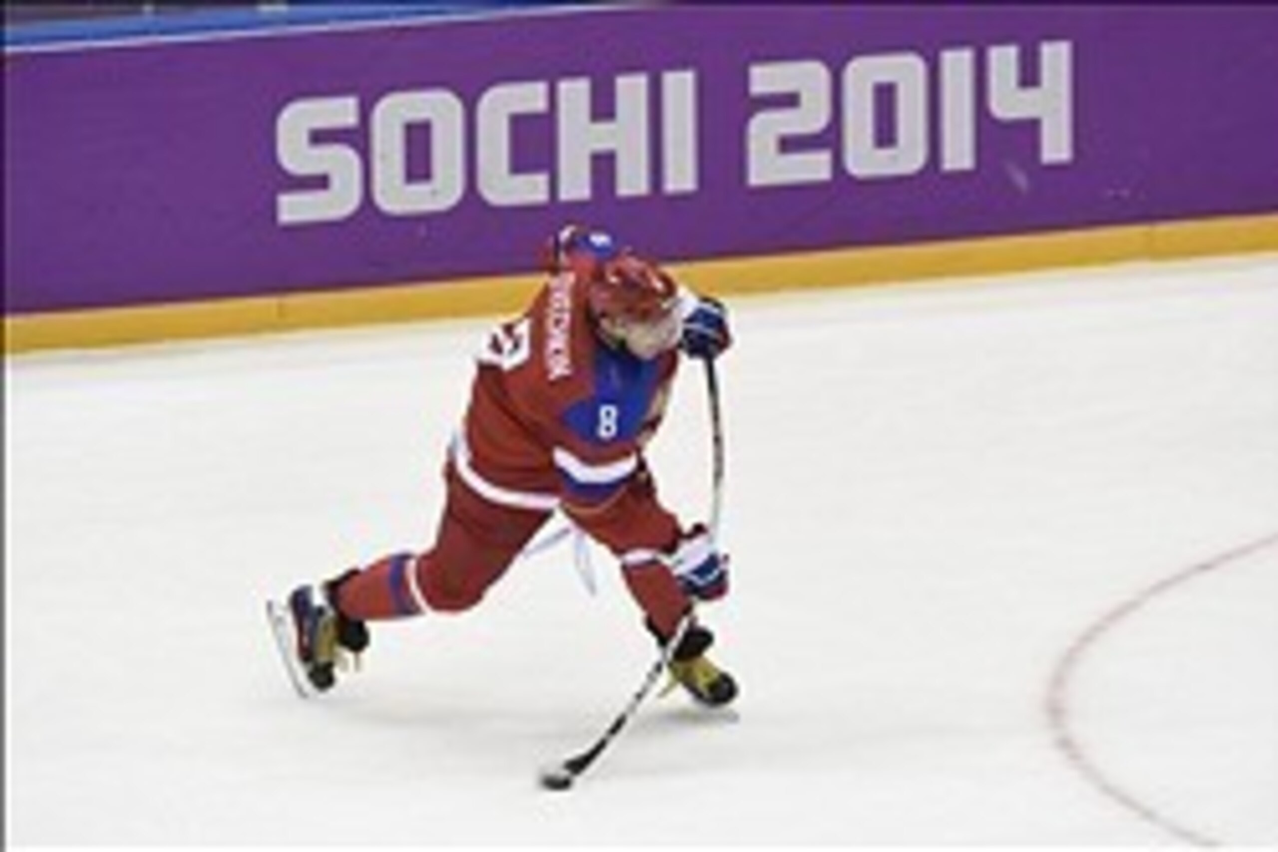 Feb 16, 2014; Sochi, RUSSIA; Russia forward Alex Ovechkin (8) hits the puck in a men's preliminary round ice hockey game against Slovakia during the Sochi 2014 Olympic Winter Games at Bolshoy Ice Dome. Mandatory Credit: Scott Rovak-USA TODAY Sports