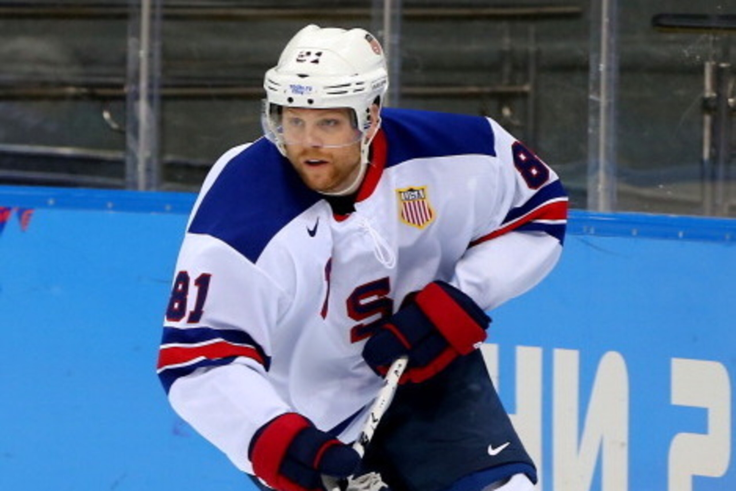 SOCHI, RUSSIA - FEBRUARY 16: Phil Kessel #81 of the United States handles the puck in the second period against Slovenia during the Men's Ice Hockey Preliminary Round Group A game on day nine of the Sochi 2014 Winter Olympics at Shayba Arena on February 1