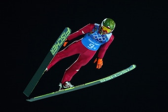 SOCHI, RUSSIA - FEBRUARY 17: Kamil Stoch of Poland jumps during the Men's Team Ski Jumping trial on day 10 of the Sochi 2014 Winter Olympics at the RusSki Gorki Ski Jumping Center on February 17, 2014 in Sochi, Russia.  (Photo by Paul Gilham/Getty Images)