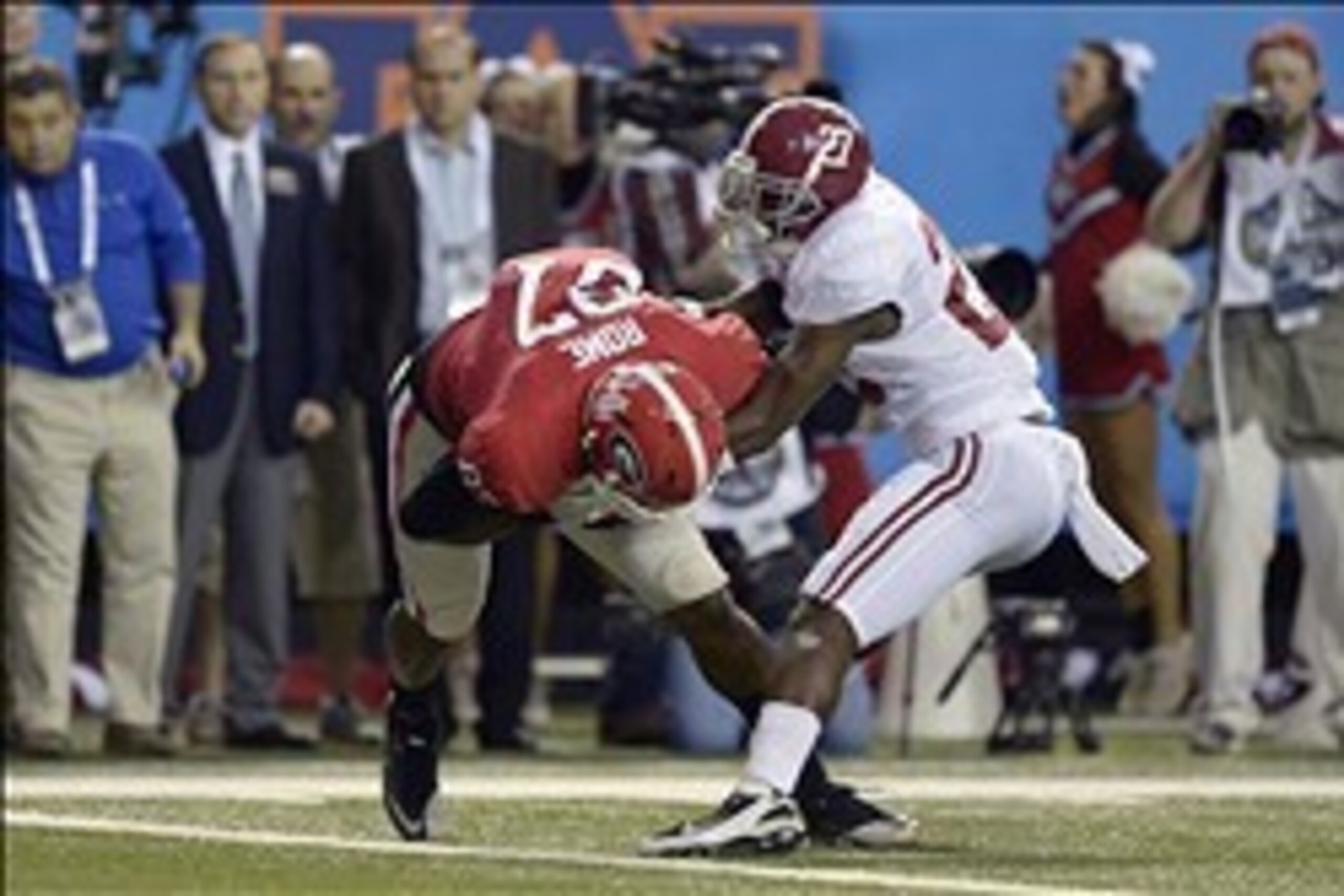 Dec 1, 2012; Atlanta, GA, USA; Georgia Bulldogs tight end Jay Rome (87) catches a pass for a touchdown against Alabama Crimson Tide defensive back Nick Perry (27) during the second quarter of the 2012 SEC Championship game at the Georgia Dome.  Mandatory 