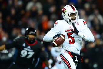 Dec 5, 2013; Cincinnati, OH, USA; Louisville Cardinals quarterback Teddy Bridgewater (5) throws a pass during the first quarter against the Cincinnati Bearcats at Nippert Stadium. Mandatory Credit: Andrew Weber-USA TODAY Sports