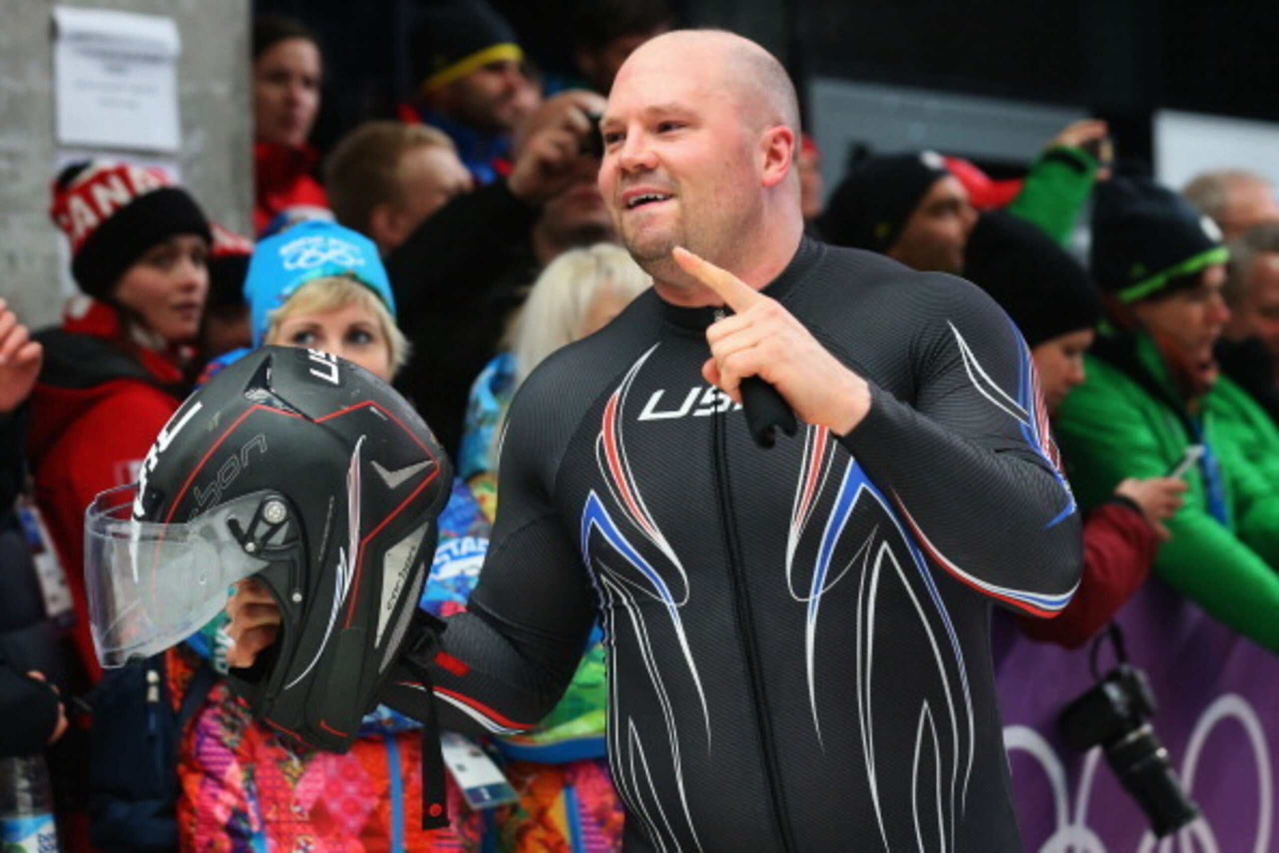 SOCHI, RUSSIA - FEBRUARY 17:  Bronze medalist Steven Holcomb of the United States team 1 celebrates after the Men's Two-Man Bobsleigh on Day 10 of the Sochi 2014 Winter Olympics at Sliding Center Sanki on February 17, 2014 in Sochi, Russia.  (Photo by Ale