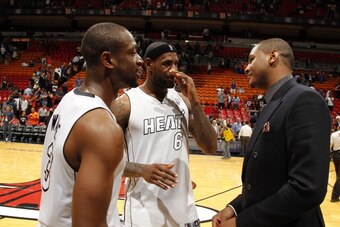 MIAMI, FL - DECEMBER 6: Dwyane Wade #3 ; LeBron James #6 ; Carmelo Anthony #7 talk after the game between the Miami Heat and the New York Knicks on December 6, 2012 at American Airlines Arena in Miami, Florida. NOTE TO USER: User expressly acknowledges an