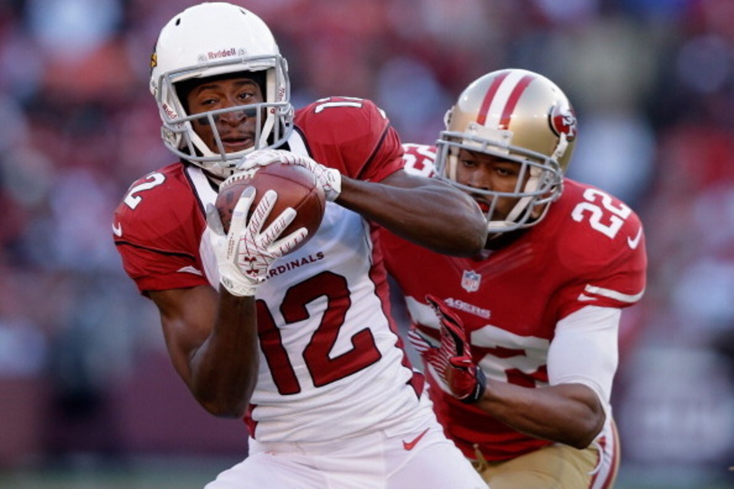 SAN FRANCISCO, CA - DECEMBER 30: Andre Roberts #12 of the Arizona Cardinals catches the ball while covered by Carlos Rogers #22 of the San Francisco 49ers at Candlestick Park on December 30, 2012 in San Francisco, California.  (Photo by Ezra Shaw/Getty Im