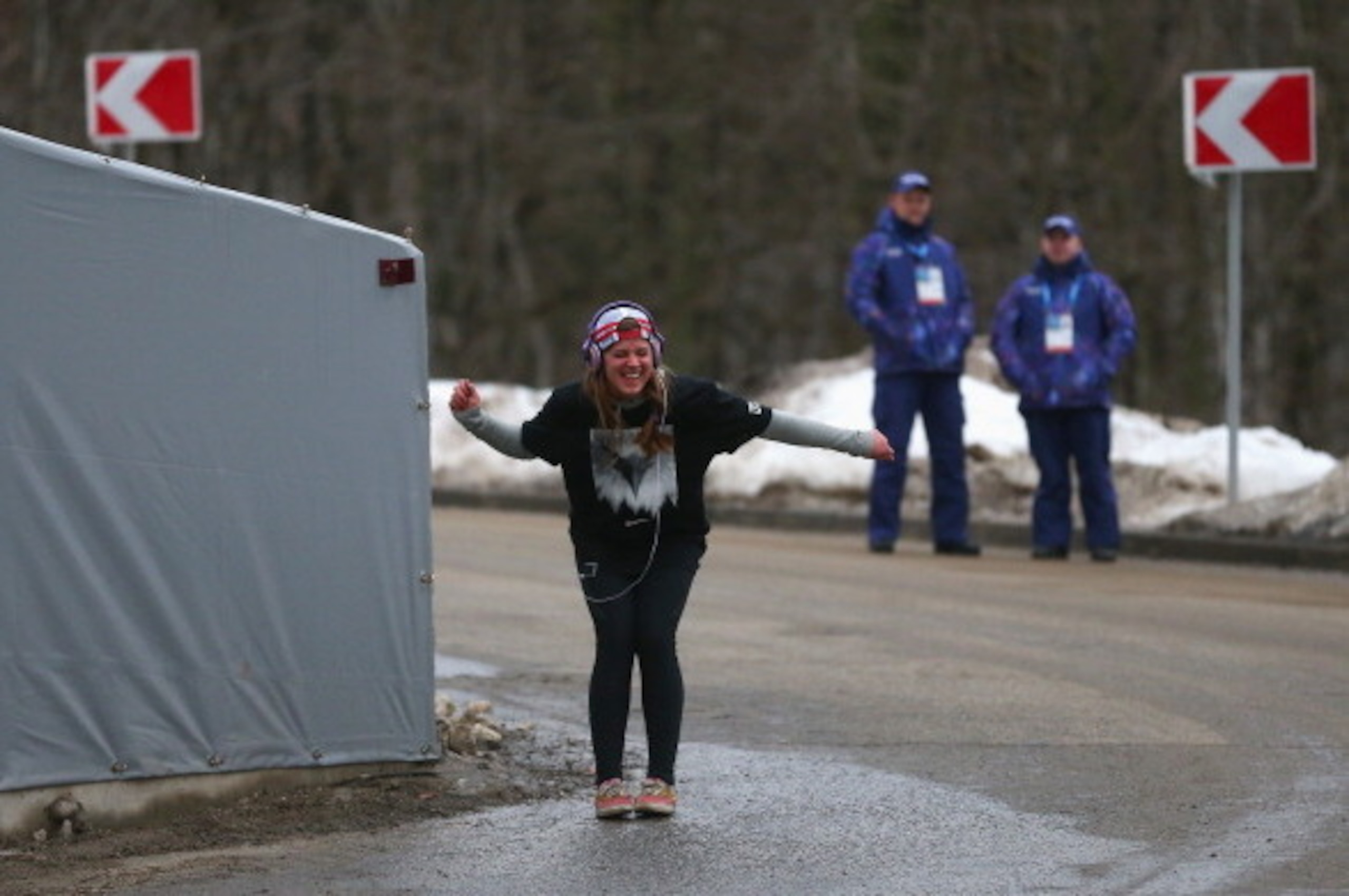 SOCHI, RUSSIA - FEBRUARY 10: Kate Hansen of the United States dances as she listens to music watched by security prior to the Women's Luge Singles on Day 3 of the Sochi 2014 Winter Olympics at Sliding Center Sanki on February 10, 2014 in Sochi, Russia. SOCHI, RUSSIA - FEBRUARY 10: Kate Hansen of the United States dances as she listens to music watched by security prior to the Women's Luge Singles on Day 3 of the Sochi 2014 Winter Olympics at Sliding Center Sanki on February 10, 2014 in Sochi, Russia.