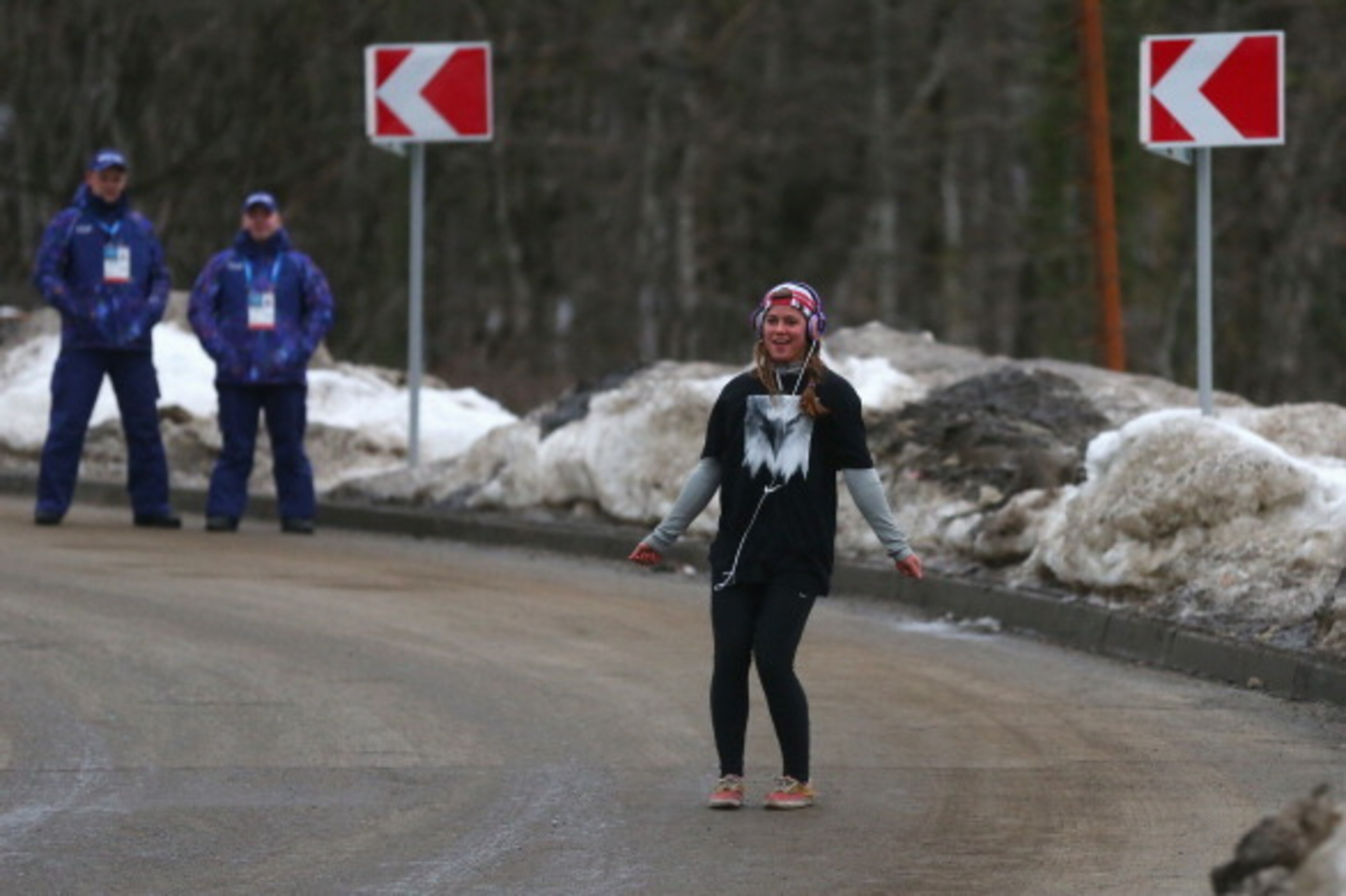 SOCHI, RUSSIA - FEBRUARY 10:  Kate Hansen of the United States dances as she listens to music watched by security prior to the Women's Luge Singles on Day 3 of the Sochi 2014 Winter Olympics at Sliding Center Sanki on February 10, 2014 in Sochi, Russia.  