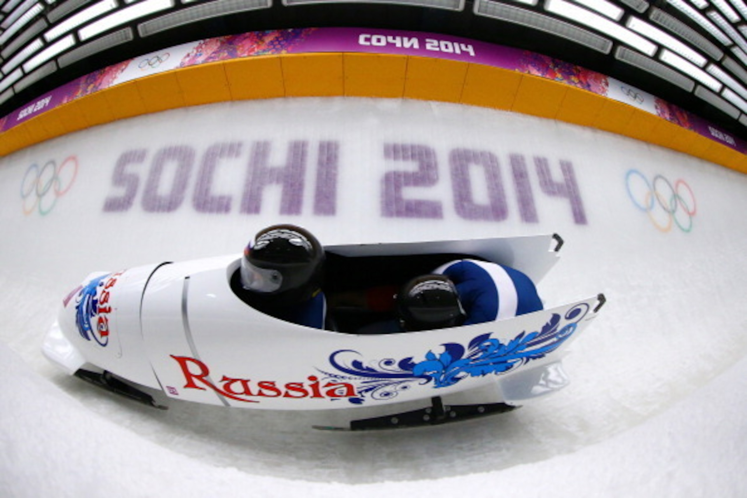 SOCHI, RUSSIA - FEBRUARY 16:  pilot Alexander Zubkov and Alexey Voevoda of Russia team 1  make a run during the Men's Two-Man Bobsleigh heats on Day 9 of the Sochi 2014 Winter Olympics at Sliding Center Sanki on February 16, 2014 in Sochi, Russia.  (Photo