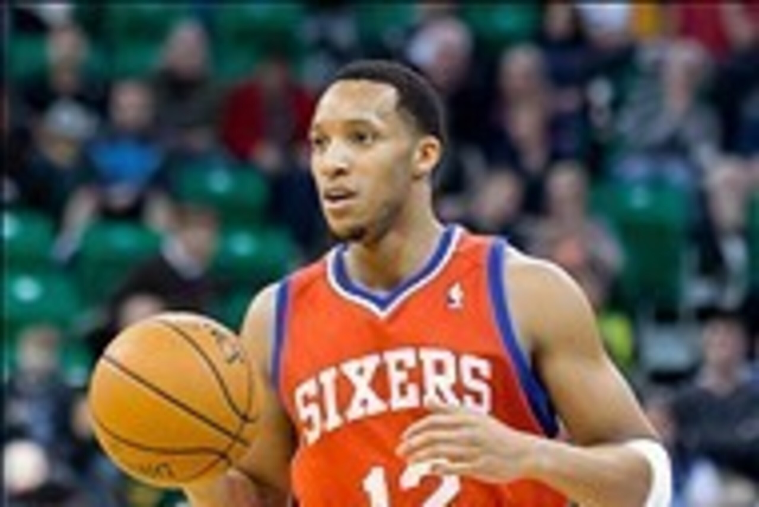 Feb 12, 2014; Salt Lake City, UT, USA; Philadelphia 76ers small forward Evan Turner (12) dribbles up the court during the first quarter against the Utah Jazz at EnergySolutions Arena. Mandatory Credit: Russ Isabella-USA TODAY Sports