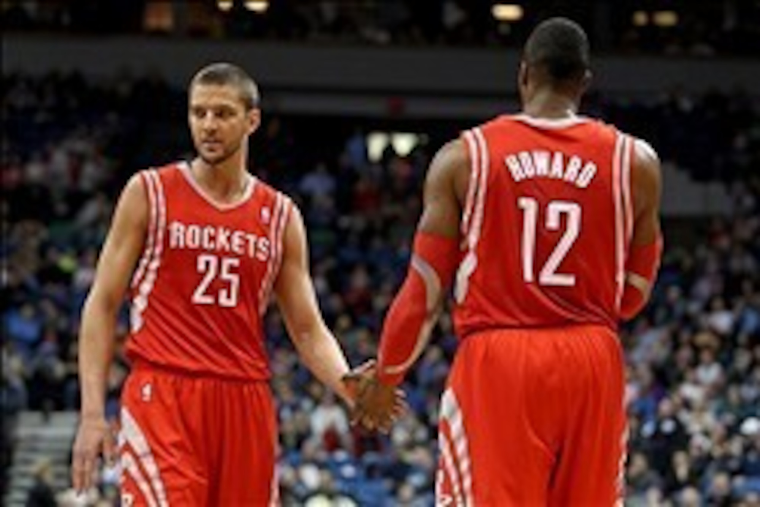 Feb 10, 2014; Minneapolis, MN, USA; Houston Rockets center Dwight Howard (12) is congratulated by Houston Rockets forward Chandler Parsons (25) during the second quarter at Target Center. Mandatory Credit: Brace Hemmelgarn-USA TODAY Sports