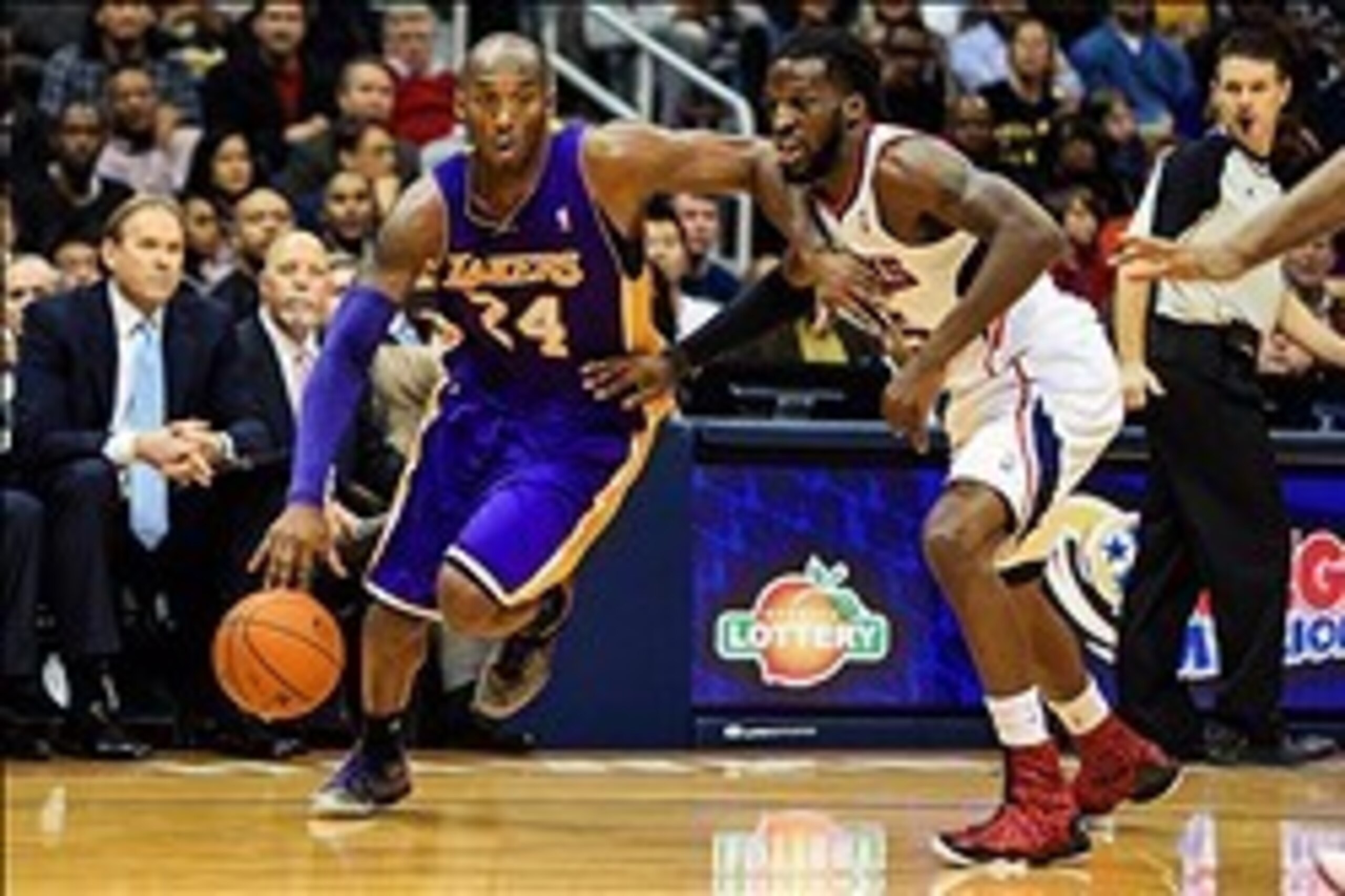 Dec 16, 2013; Atlanta, GA, USA; Los Angeles Lakers shooting guard Kobe Bryant (24) drives to the basket past Atlanta Hawks small forward DeMarre Carroll (5) in the first half at Philips Arena. Mandatory Credit: Daniel Shirey-USA TODAY Sports Dec 16, 2013; Atlanta, GA, USA; Los Angeles Lakers shooting guard Kobe Bryant (24) drives to the basket past Atlanta Hawks small forward DeMarre Carroll (5) in the first half at Philips Arena. Mandatory Credit: Daniel Shirey-USA TODAY Sports