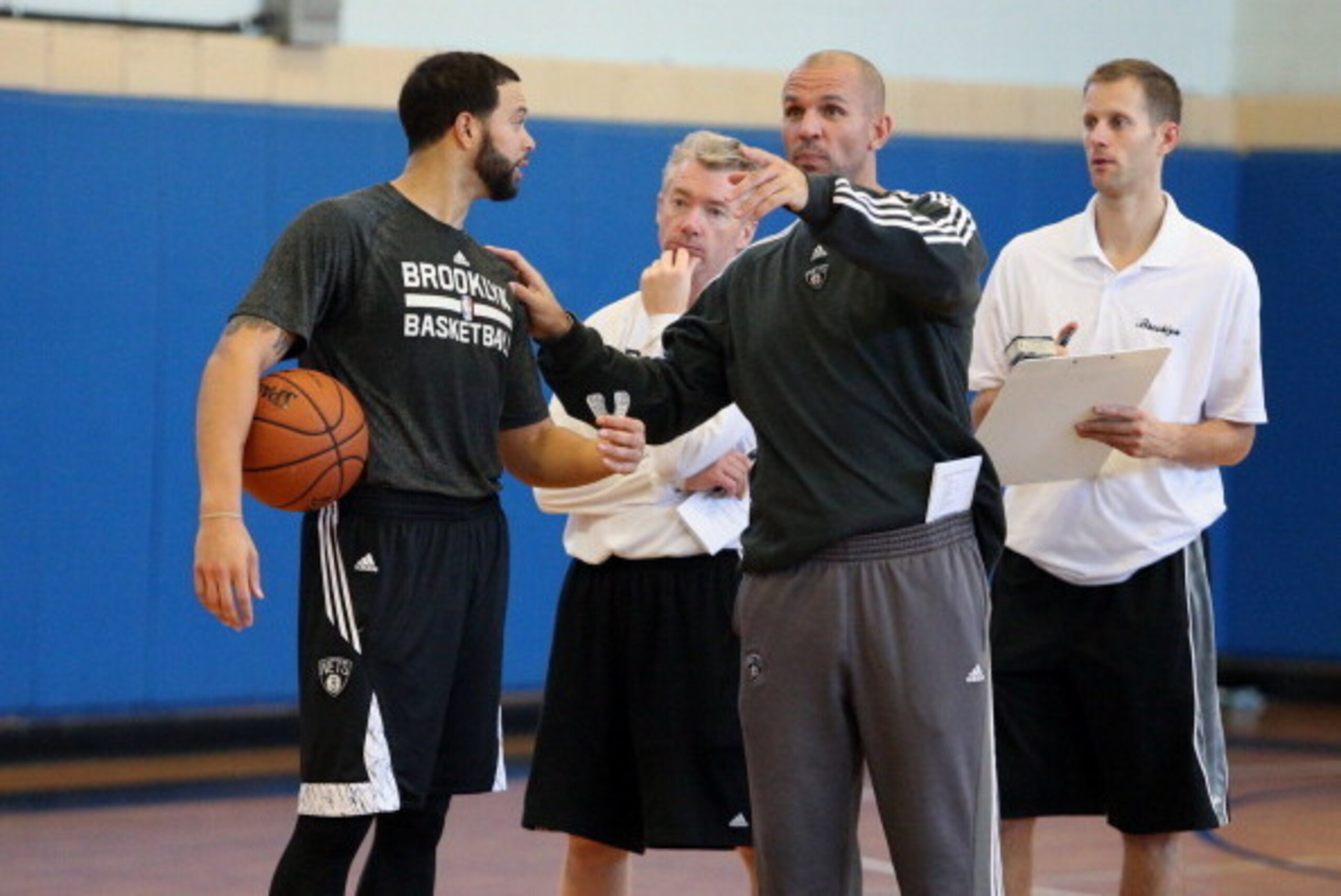BROOKLYN, NY - November 11:  Deron Williams #8 and Jason Kidd of the Brooklyn Nets during a team event in celebration of Veterans Day at Ft. Hamilton, Brooklyn on November 11, 2013 in the Brooklyn borough of New York City.  NOTE TO USER: User expressly ac
