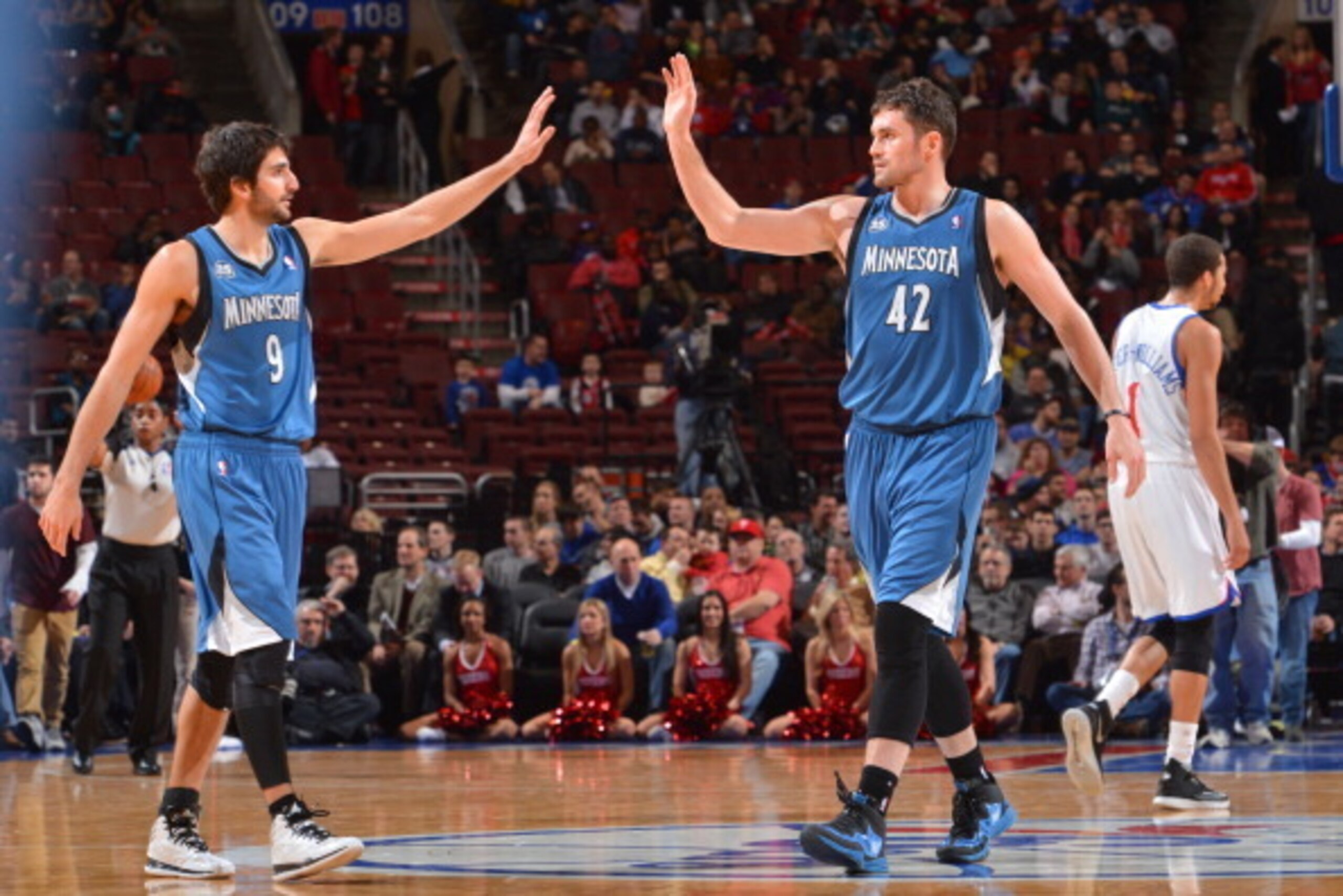 PHILADELPHIA, PA - JANUARY 6: Ricky Rubio #9 and Kevin Love #42 of the Minnesota Timberwolves slap hands against the Philadelphia 76ers at the Wells Fargo Center on January 6, 2014 in Philadelphia, Pennsylvania. NOTE TO USER: User expressly acknowledges a