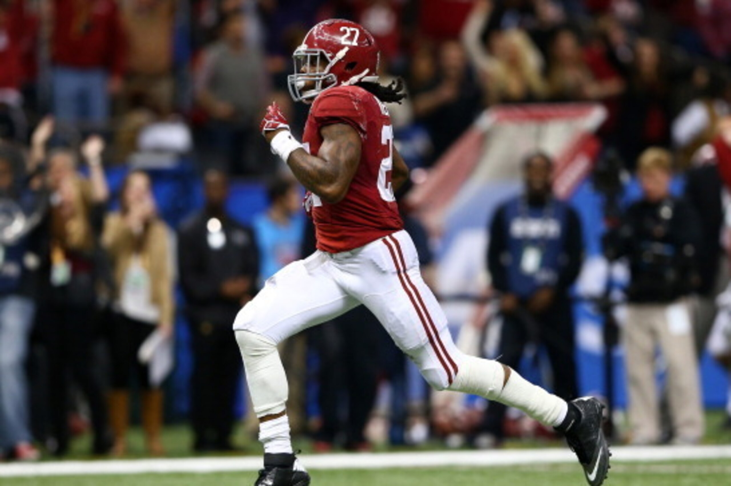 NEW ORLEANS, LA - JANUARY 02:  Derrick Henry #27 of the Alabama Crimson Tide runs for a 61 yard touchdown against the Oklahoma Sooners during the Allstate Sugar Bowl at the Mercedes-Benz Superdome on January 2, 2014 in New Orleans, Louisiana.  (Photo by S