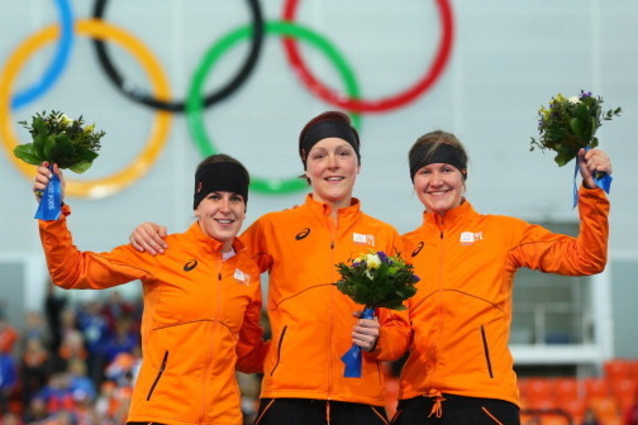 SOCHI, RUSSIA - FEBRUARY 16: (L-R) Silver medalist Ireen Wust of the Netherlands, gold medalist Jorien ter Mors of the Netherlands and bronze medalist Lotte van Beek of the Netherlands on the podium during the flower ceremony for the Speed Skating Women' SOCHI, RUSSIA - FEBRUARY 16: (L-R) Silver medalist Ireen Wust of the Netherlands, gold medalist Jorien ter Mors of the Netherlands and bronze medalist Lotte van Beek of the Netherlands on the podium during the flower ceremony for the Speed Skating Women'