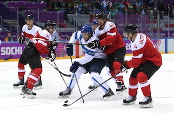 SOCHI, RUSSIA - FEBRUARY 13:  Tuomo Ruutu #15 of Finland skates against Austria during the Men's Ice Hockey Preliminary Round Group B game on day six of the Sochi 2014 Winter Olympics at Bolshoy Ice Dome on February 13, 2014 in Sochi, Russia.  (Photo by B