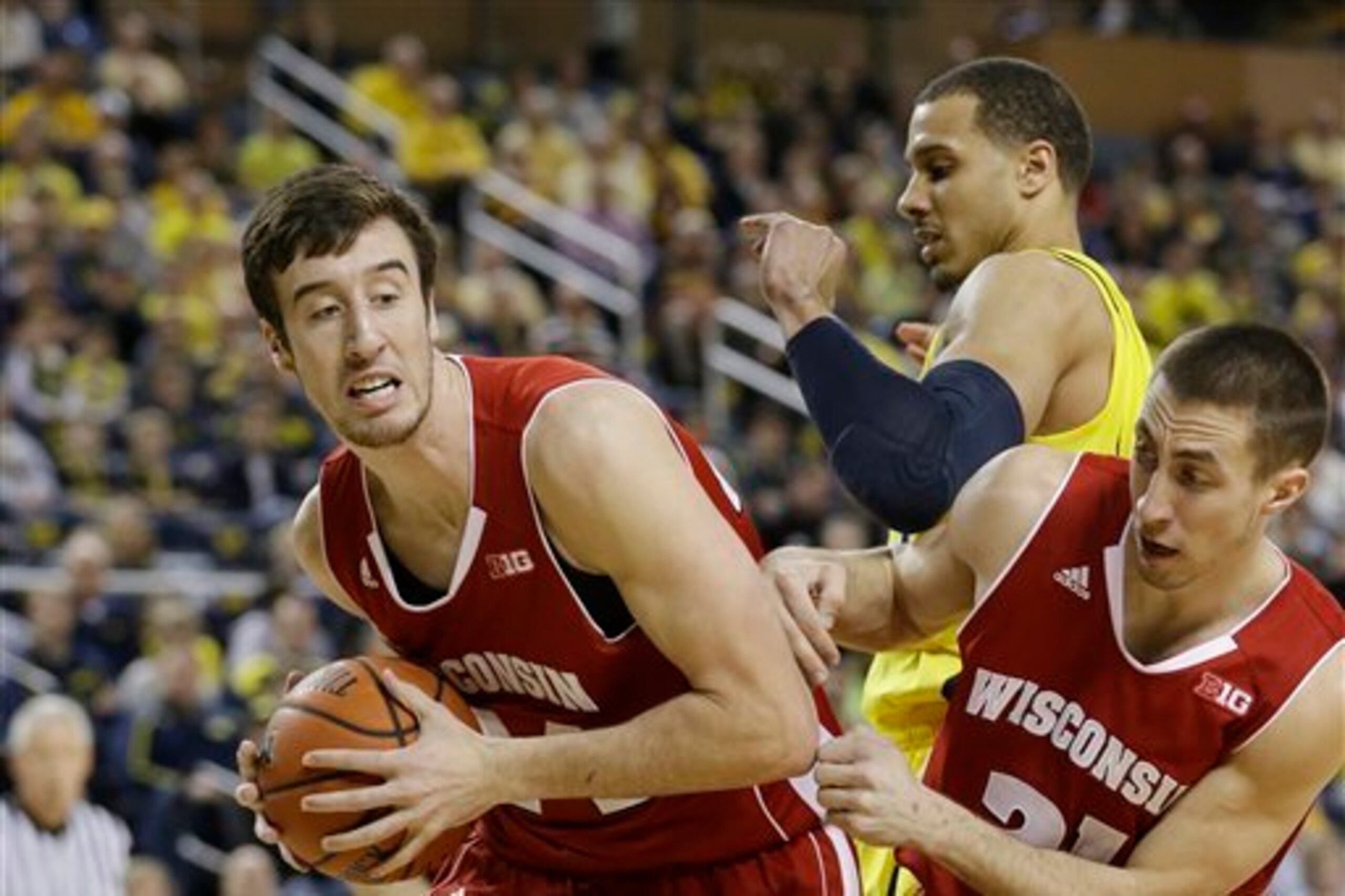 Frank Kaminsky's 25 points and 11 rebounds pushed the Badgers to a 75-62 win over UM.