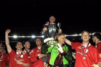 26 May 1999:  Alex Ferguson celebrates with Manchester United players and the European Cup after winning the European Champions League Final against Bayern Munich in the Nou Camp Stadium, Barcelona, Spain. Manchester United won 2 - 1 with both United goal