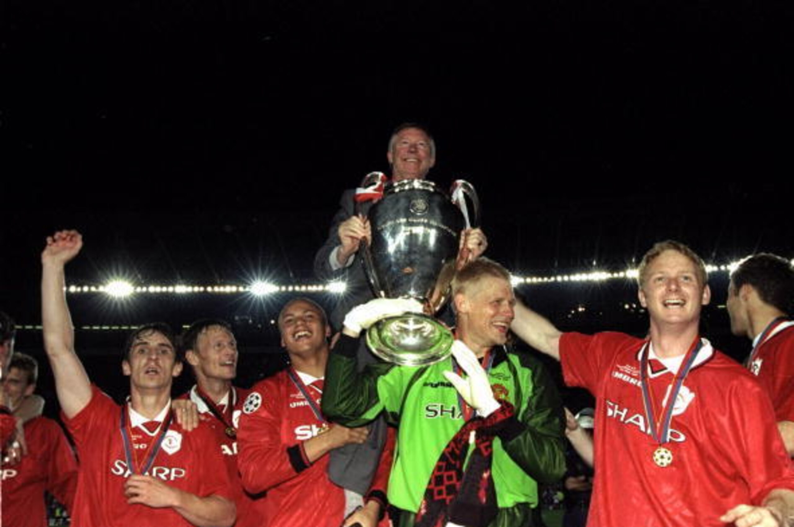 26 May 1999:  Alex Ferguson celebrates with Manchester United players and the European Cup after winning the European Champions League Final against Bayern Munich in the Nou Camp Stadium, Barcelona, Spain. Manchester United won 2 - 1 with both United goal
