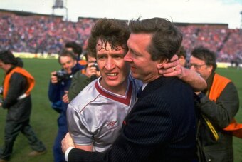 1986:  Alex Ferguson (right)  Manager of Aberdeen hugs Sandy Jardine (left) of Hearts in commiseration after the Scottish Cup Final match at Hampden Park in Glasgow, Scotland. Aberdeen won the match 3-0. \ Mandatory Credit: Allsport UK /Allsport