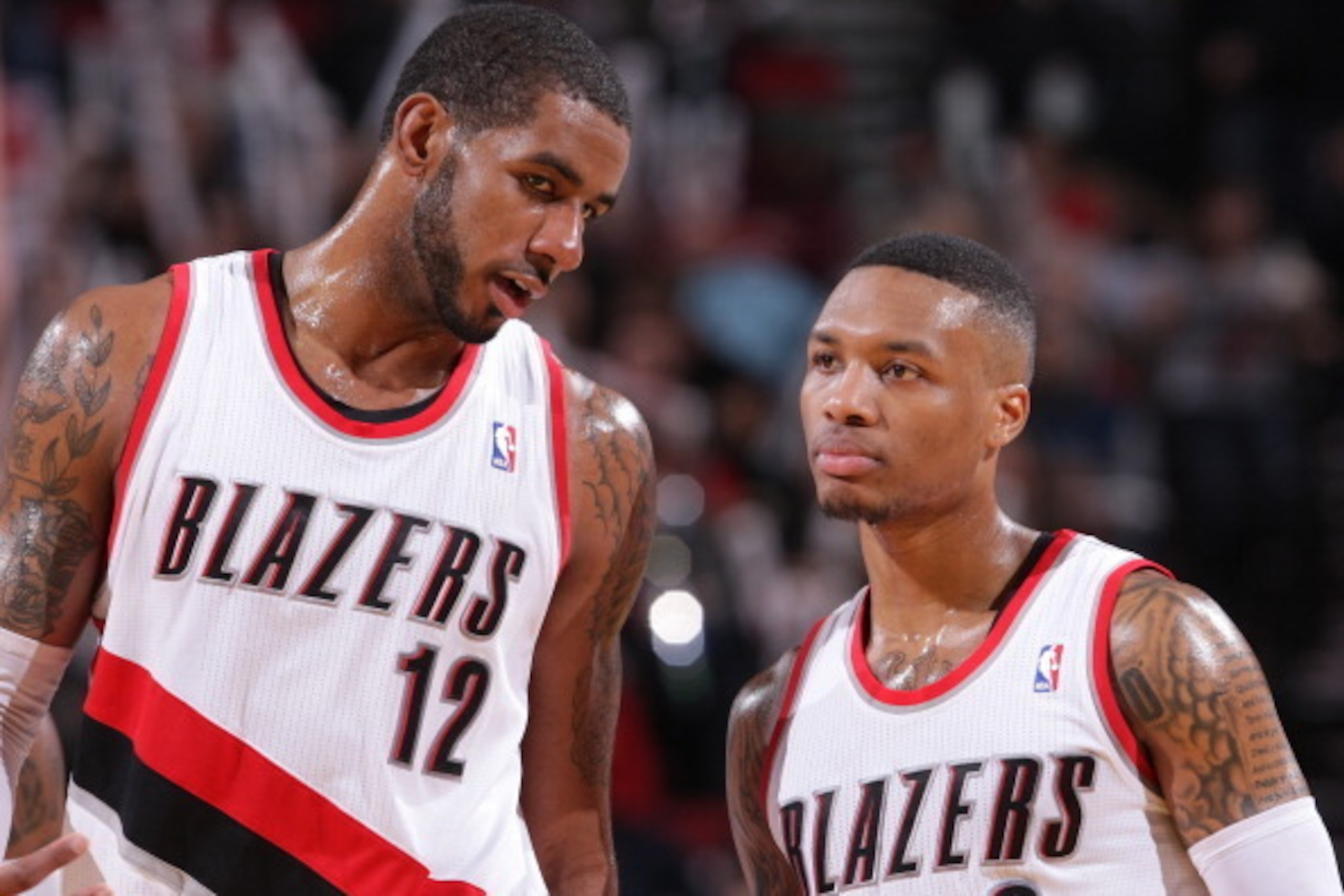 PORTLAND, OR - JANUARY 28: LaMarcus Aldridge #12 and Damian Lillard #0 of the Portland Trail Blazers talk against the Memphis Grizzlies on January 28, 2014 at the Moda Center Arena in Portland, Oregon. NOTE TO USER: User expressly acknowledges and agrees PORTLAND, OR - JANUARY 28: LaMarcus Aldridge #12 and Damian Lillard #0 of the Portland Trail Blazers talk against the Memphis Grizzlies on January 28, 2014 at the Moda Center Arena in Portland, Oregon. NOTE TO USER: User expressly acknowledges and agrees