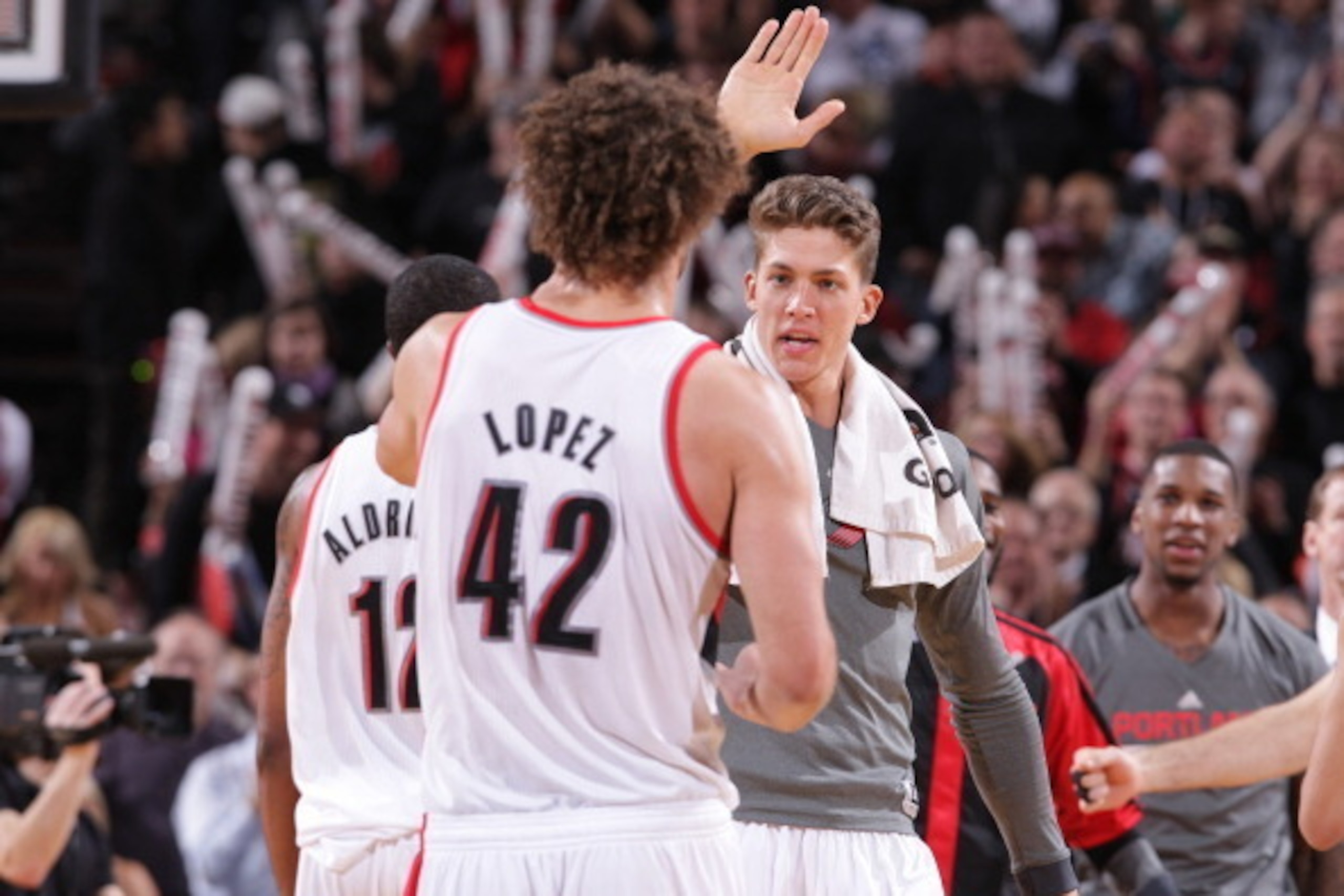 PORTLAND, OR - JANUARY 15: Robin Lopez #42 and Meyers Leonard #11 of the Portland Trail Blazers celebrate against the Cleveland Cavaliers on January 15, 2014 at the Moda Center Arena in Portland, Oregon. NOTE TO USER: User expressly acknowledges and agre PORTLAND, OR - JANUARY 15: Robin Lopez #42 and Meyers Leonard #11 of the Portland Trail Blazers celebrate against the Cleveland Cavaliers on January 15, 2014 at the Moda Center Arena in Portland, Oregon. NOTE TO USER: User expressly acknowledges and agre
