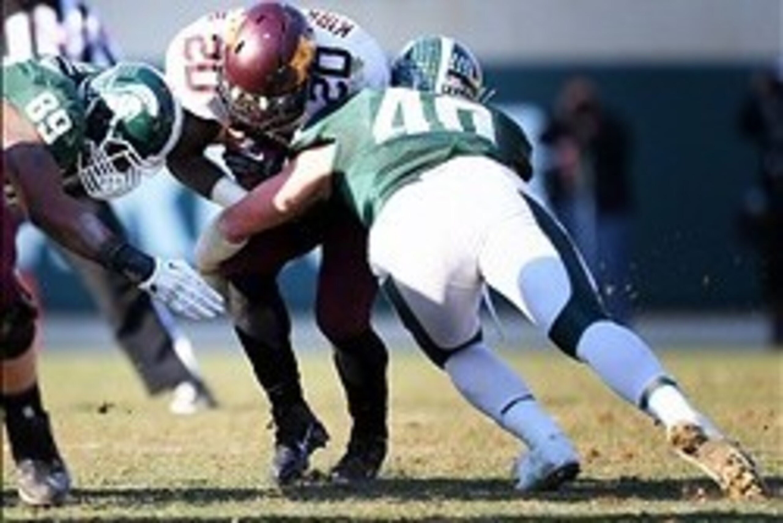 Nov 30, 2013; East Lansing, MI, USA; Minnesota Golden Gophers running back Donnell Kirkwood (20) is tackled by Michigan State Spartans linebacker Max Bullough (40) during the 2nd half a game at Spartan Stadium. MSU won 14-3.  Mandatory Credit: Mike Carter