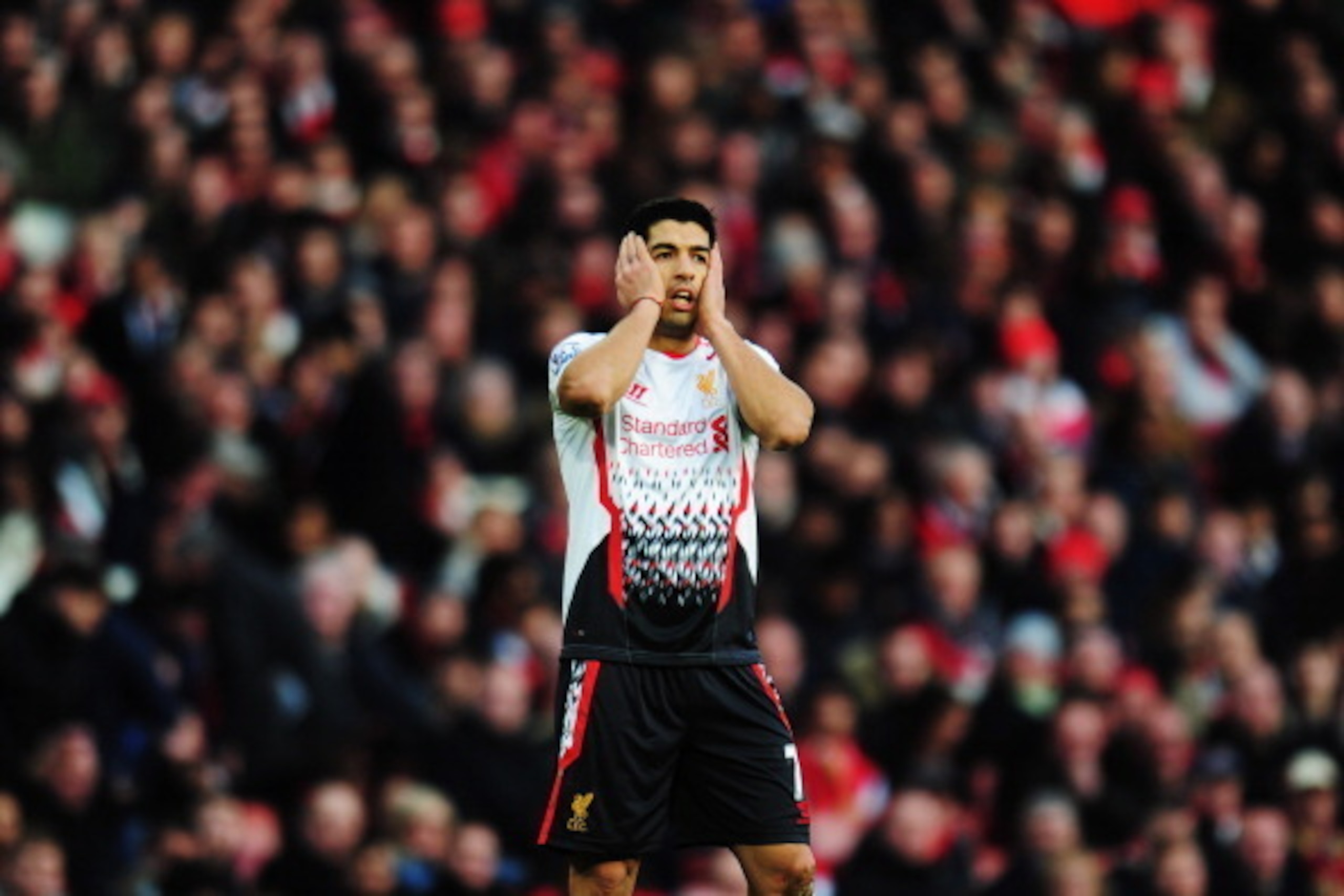 LONDON, ENGLAND - FEBRUARY 16:  Luis Suarez of Liverpool reacts during the FA Cup Fifth Round match between Arsenal and Liverpool at the Emirates Stadium on February 16, 2014 in London, England.  (Photo by Shaun Botterill/Getty Images)