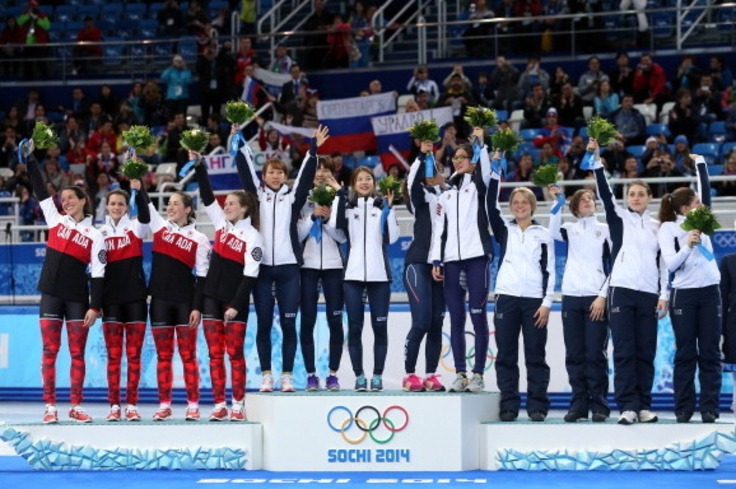 SOCHI, RUSSIA - FEBRUARY 18: Medalists from South Korea, Canada and Italy celebrate on the podium during the flower ceremony for the Short Track Ladies' 3000m Relay at Iceberg Skating Palace on day 11 of the 2014 Sochi Winter Olympics on February 18, 201 SOCHI, RUSSIA - FEBRUARY 18: Medalists from South Korea, Canada and Italy celebrate on the podium during the flower ceremony for the Short Track Ladies' 3000m Relay at Iceberg Skating Palace on day 11 of the 2014 Sochi Winter Olympics on February 18, 201