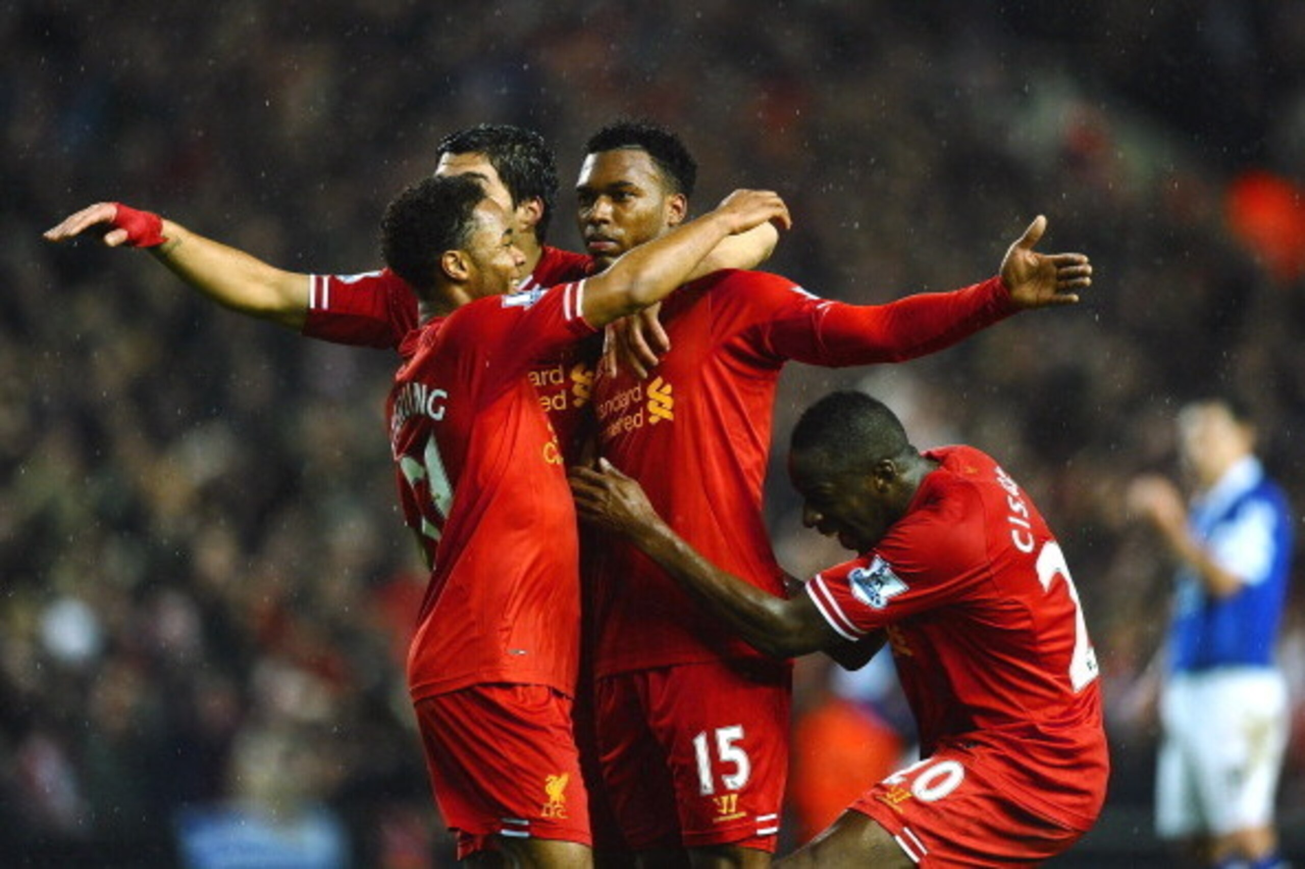 LIVERPOOL, ENGLAND - JANUARY 28:  Daniel Sturridge (C) of Liverpool is congratulated by teammates Luis Suarez (2nd L), Raheem Sterling (L) and  after scoring his team's third goal Aly Cissokho during the Barclays Premier League match between Liverpool and