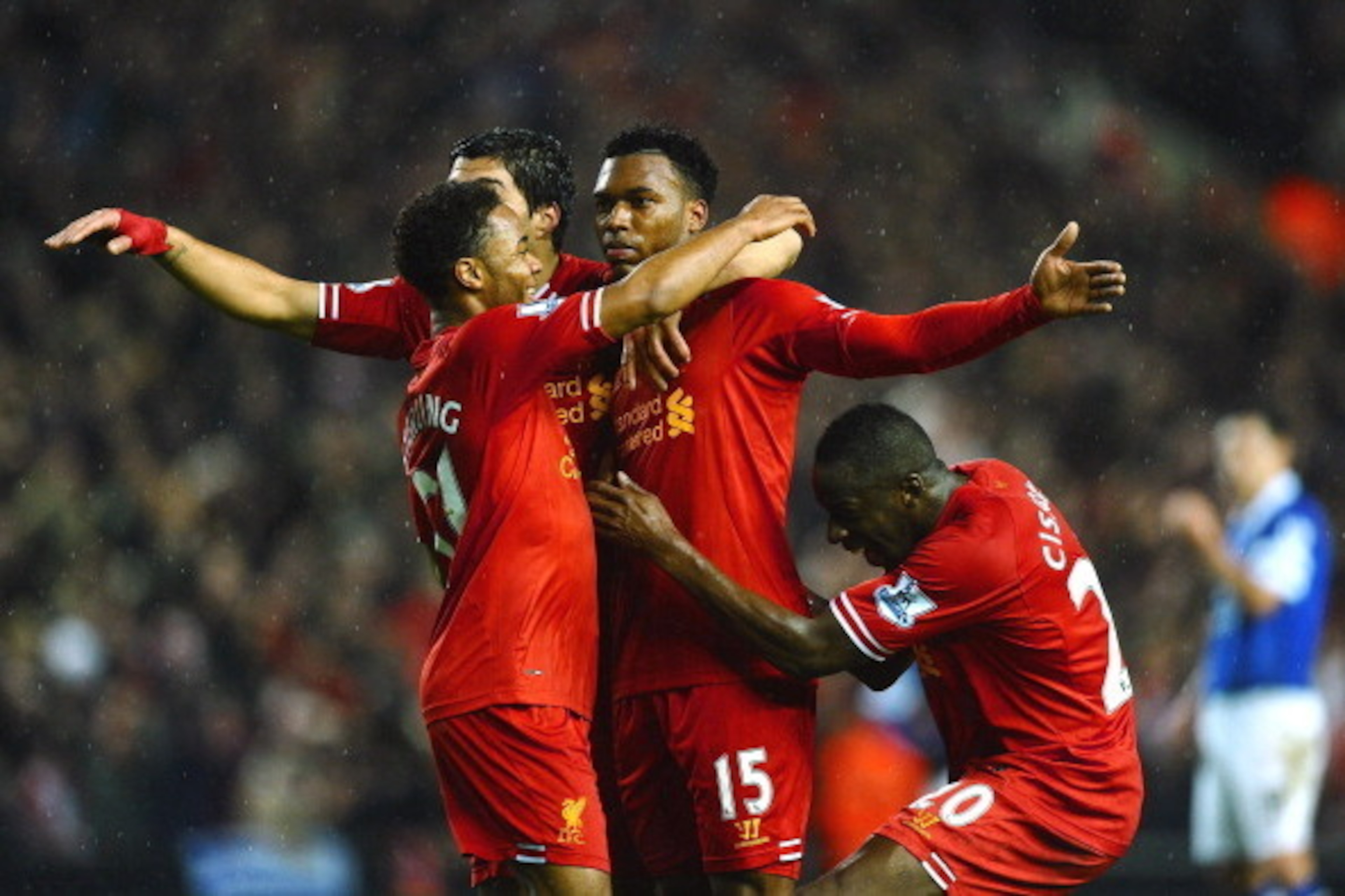LIVERPOOL, ENGLAND - JANUARY 28:  Daniel Sturridge (C) of Liverpool is congratulated by teammates Luis Suarez (2nd L), Raheem Sterling (L) and  after scoring his team's third goal Aly Cissokho during the Barclays Premier League match between Liverpool and