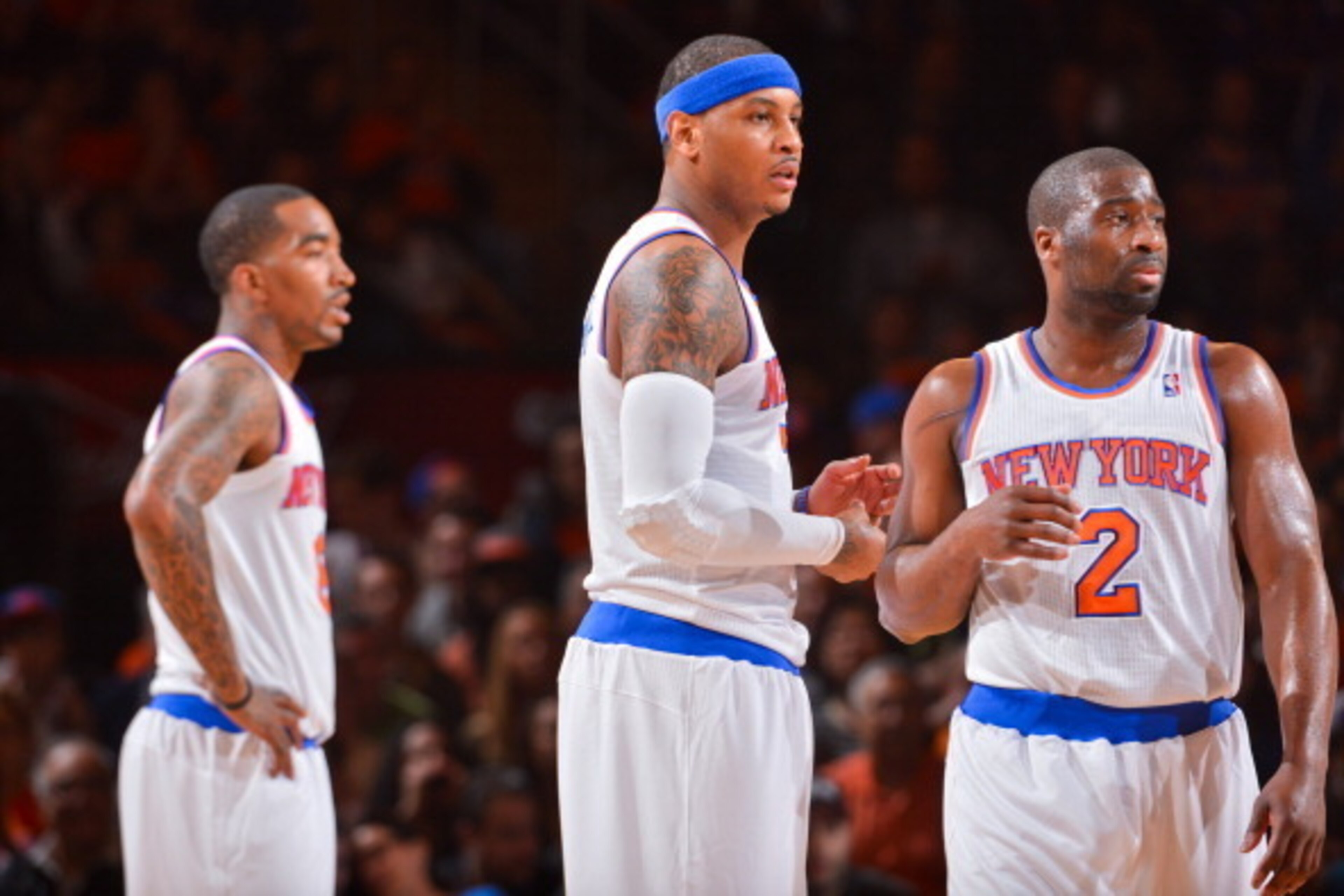 NEW YORK, NY - APRIL 20: New York Knicks players J.R. Smith #8, Carmelo Anthony #7 and Raymond Felton #2 look on before resuming play action against the Boston Celtics in Game One of the Eastern Conference Quarterfinals during the 2013 NBA Playoffs on Apr