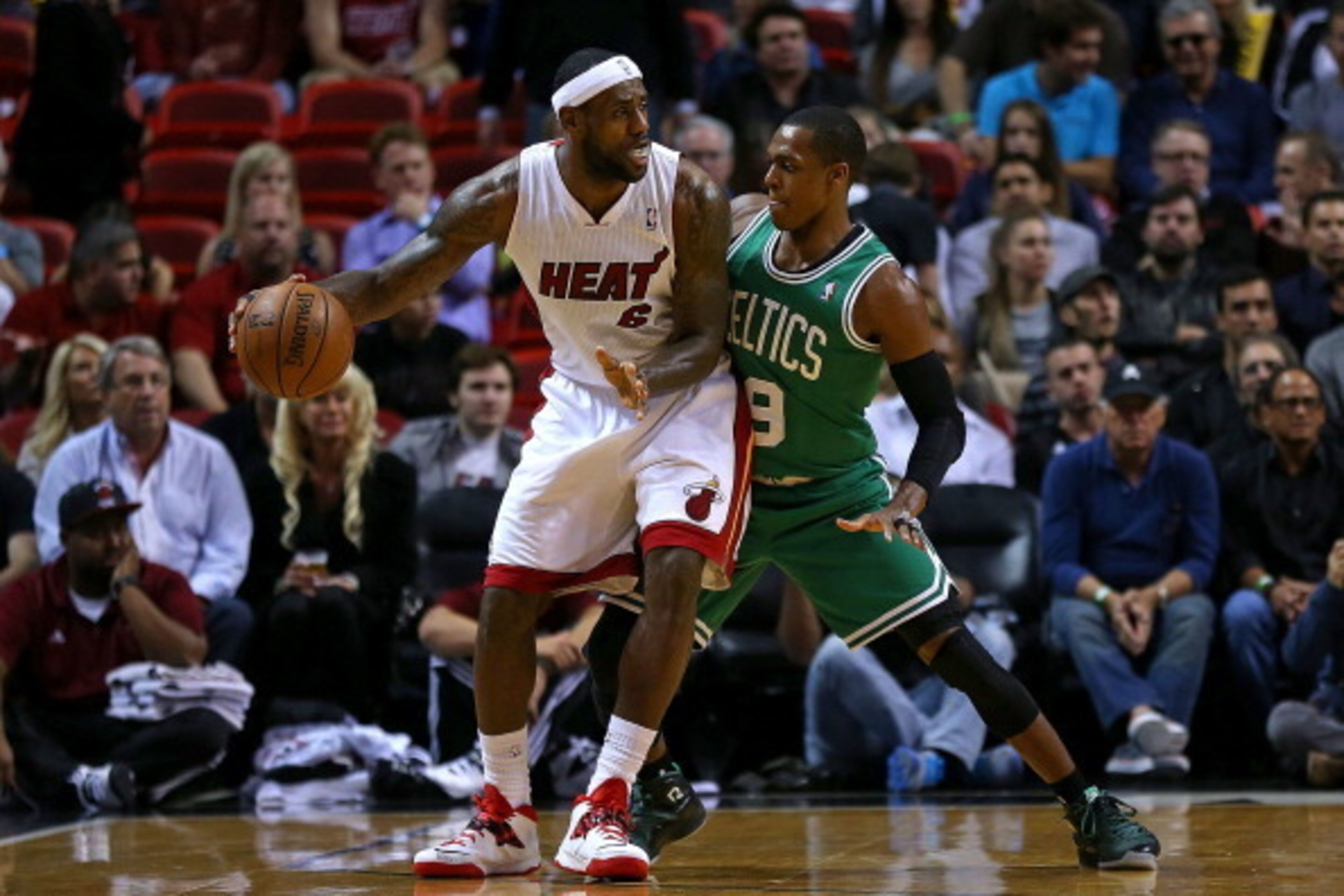 MIAMI, FL - JANUARY 21:  LeBron James #6 of the Miami Heat posts up Rajon Rondo #9 of the Boston Celtics during a game  at AmericanAirlines Arena on January 21, 2014 in Miami, Florida. NOTE TO USER: User expressly acknowledges and agrees that, by download