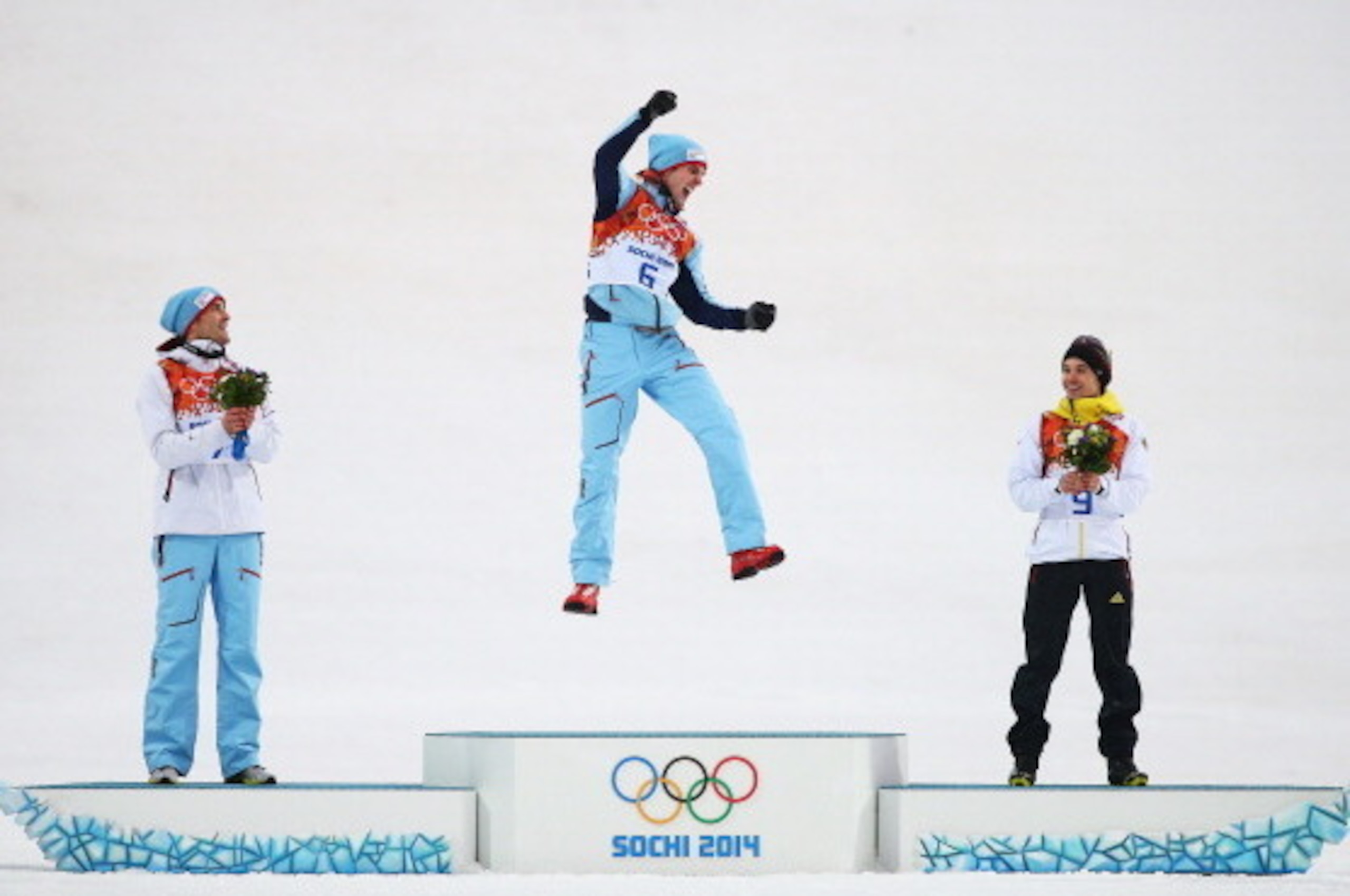 SOCHI, RUSSIA - FEBRUARY 18: (L-R) Silver medalist Magnus Hovdal Moan of Norway, gold medalist Joergen Graabak of Norway and bronze medalist Fabian Riessle of Germany celebrate on the podium during the flower ceremony for the Men's Nordic Combined on day SOCHI, RUSSIA - FEBRUARY 18: (L-R) Silver medalist Magnus Hovdal Moan of Norway, gold medalist Joergen Graabak of Norway and bronze medalist Fabian Riessle of Germany celebrate on the podium during the flower ceremony for the Men's Nordic Combined on day