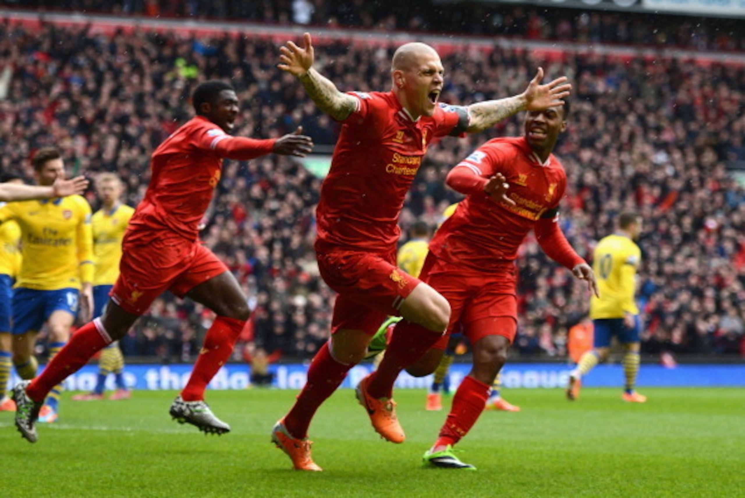 LIVERPOOL, ENGLAND - FEBRUARY 08:  Martin Skrtel of Liverpool celebrates scoring the opening goal during the Barclays Premier League match between Liverpool and Arsenal at Anfield on February 8, 2014 in Liverpool, England.  (Photo by Michael Regan/Getty I