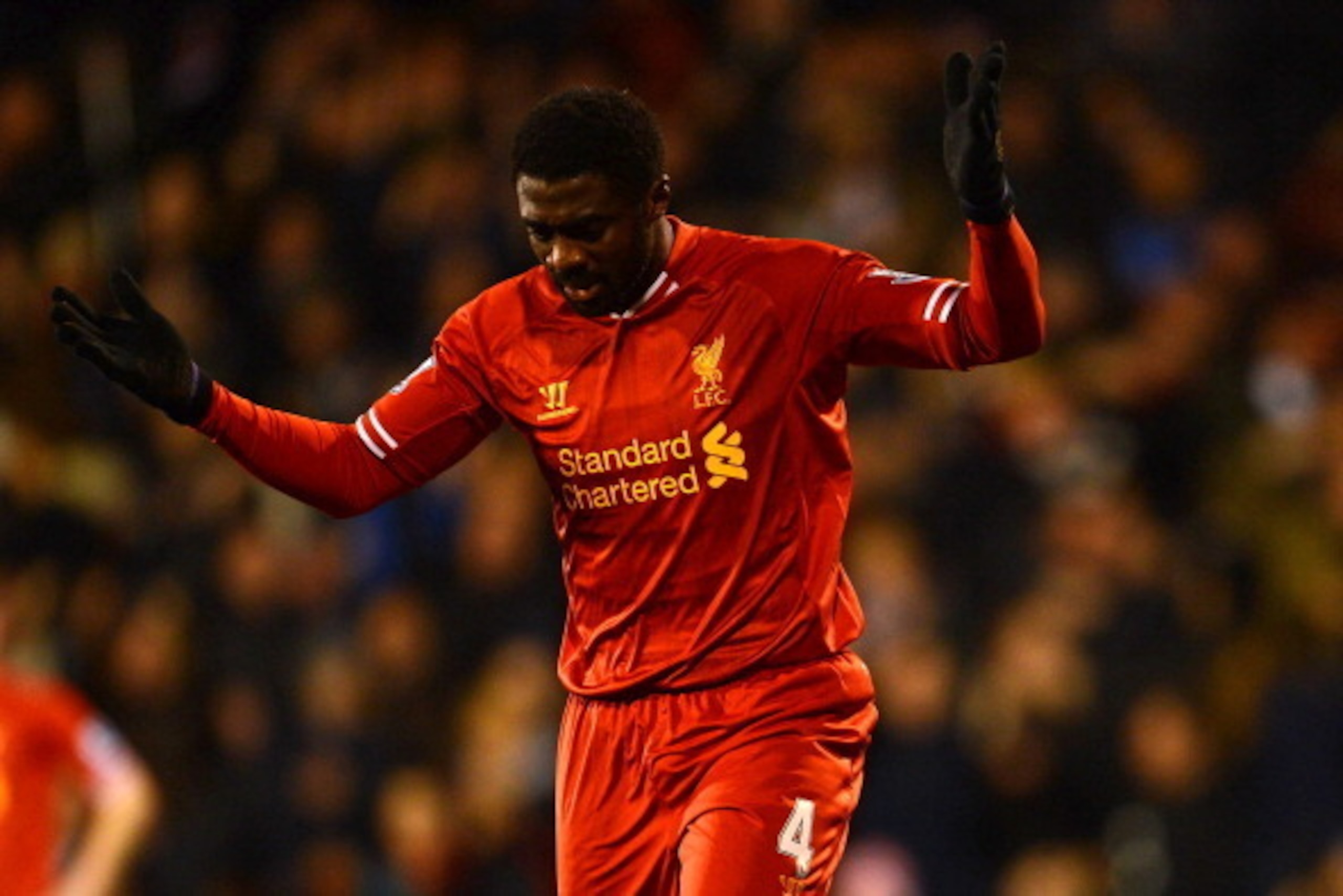 LONDON, ENGLAND - FEBRUARY 12:  Kolo Toure of Liverpool reacts after he scored an own goal during the Barclays Premier League match between Fulham and Liverpool at Craven Cottage on February 12, 2014 in London, England.  (Photo by Mike Hewitt/Getty Images