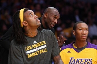 LOS ANGELES, CA - OCTOBER 29:  Kobe Bryant of the Los Angeles Lakers talks to Jordan Hill (L) #27 and Wesley Johnson #11 during the game against the Los Angeles Clippers at Staples Center on October 29, 2013 in Los Angeles, California. NOTE TO USER: User 