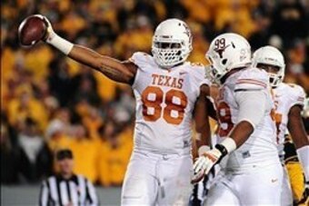 Nov 9, 2013; Morgantown, WV, USA; Texas Longhorns defensive end Cedric Reed (88) reacts after recovering a fumble in the second quarter against the West Virginia Mountaineers at Milan Puskar Stadium. Mandatory Credit: Evan Habeeb-USA TODAY Sports