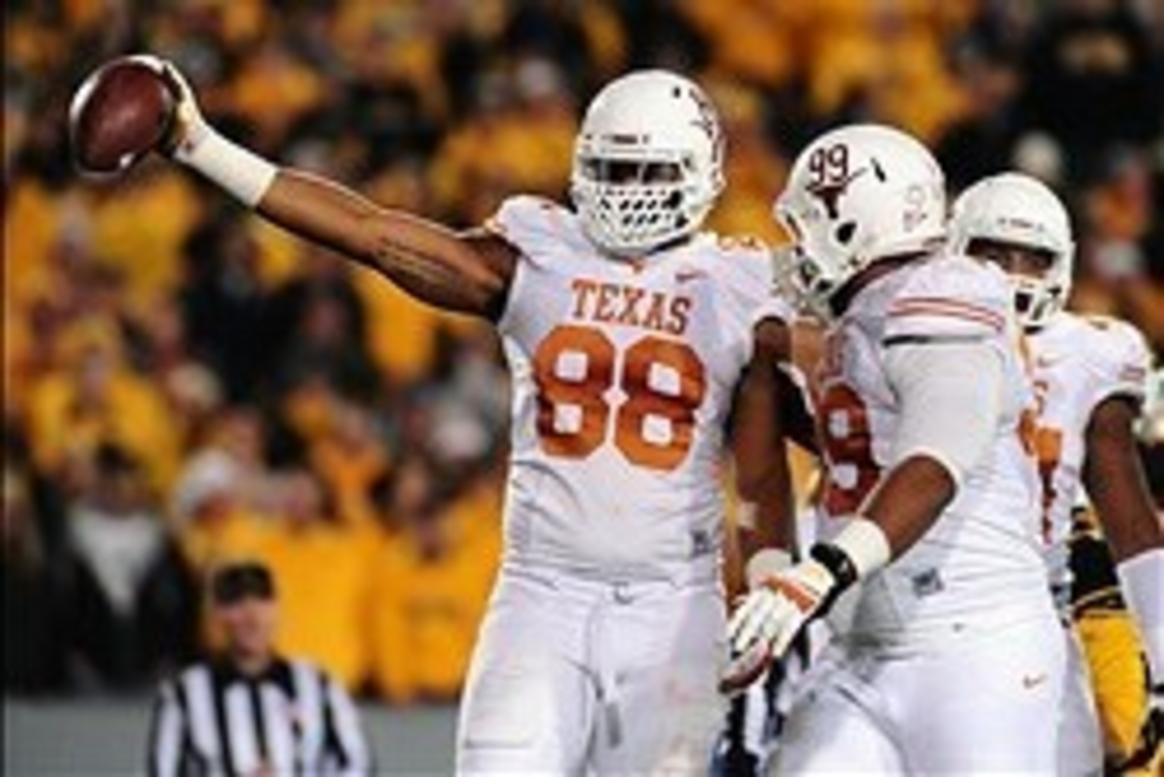 Nov 9, 2013; Morgantown, WV, USA; Texas Longhorns defensive end Cedric Reed (88) reacts after recovering a fumble in the second quarter against the West Virginia Mountaineers at Milan Puskar Stadium. Mandatory Credit: Evan Habeeb-USA TODAY Sports