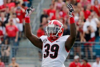 JACKSONVILLE, FL - NOVEMBER 02:  Corey Moore #39 of the Georgia Bulldogs asks the crowd for noise during the game against the Florida Gators at EverBank Field on November 2, 2013 in Jacksonville, Florida.  (Photo by Sam Greenwood/Getty Images)