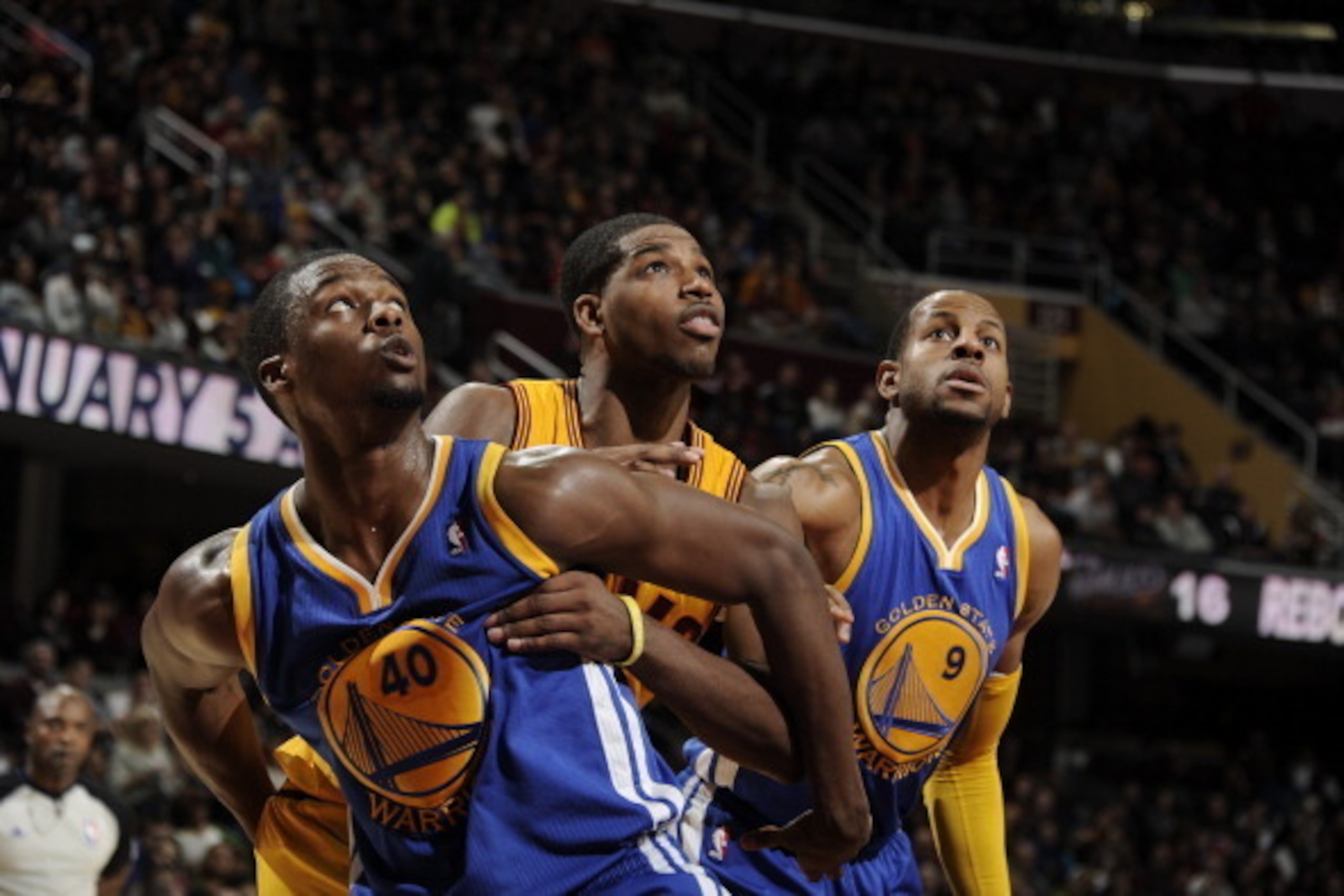 CLEVELAND, OH - DECEMBER 29:  Tristan Thompson #13 of the Cleveland Cavaliers fights for position against Harrison Barnes #40 and Andre Iguodala #9 of the Golden State Warriors at The Quicken Loans Arena on December 29, 2013 in Cleveland, Ohio. NOTE TO US